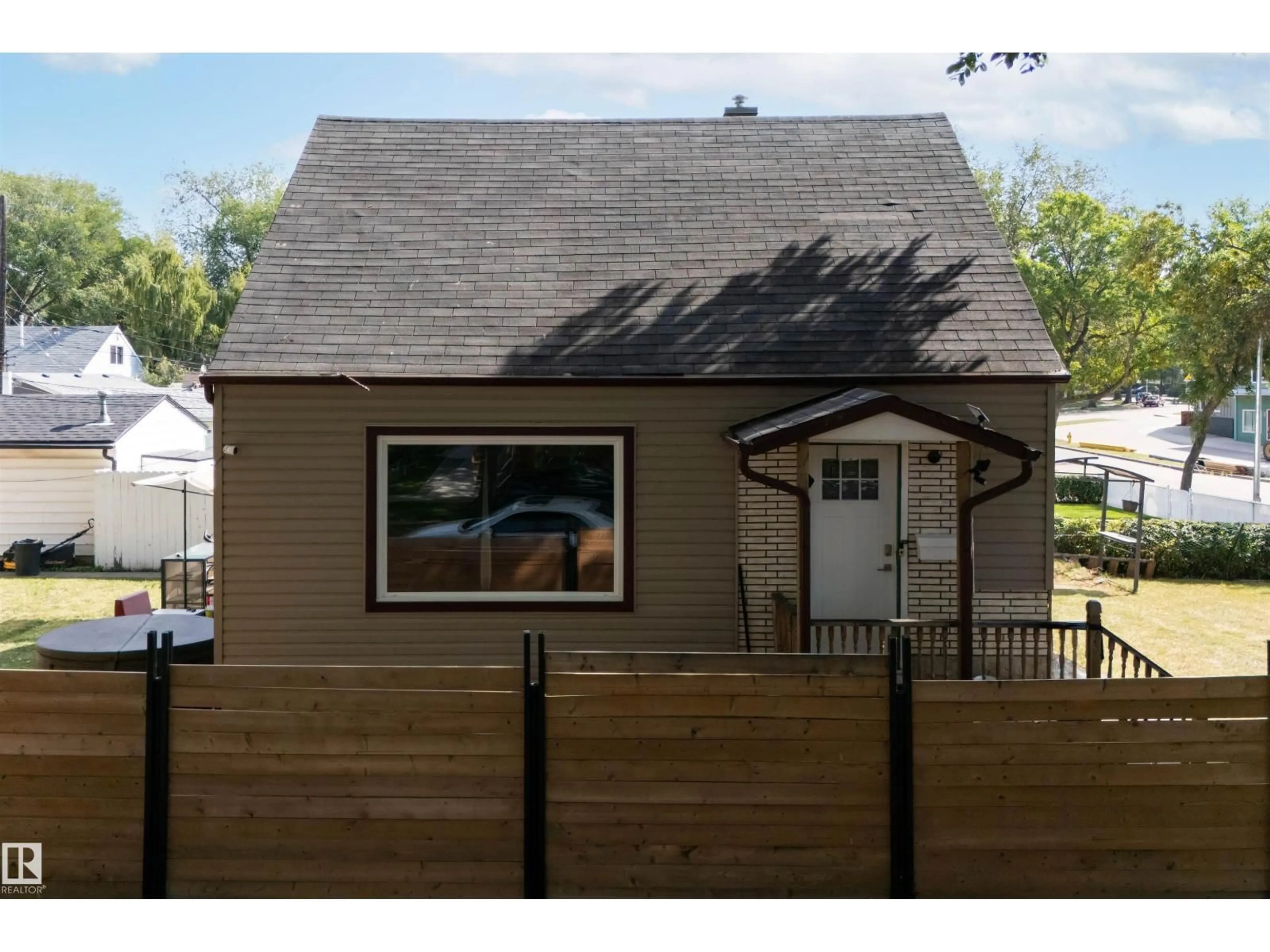 Home with vinyl exterior material, street for NW - 6014 120 AV, Edmonton Alberta T5W1L7
