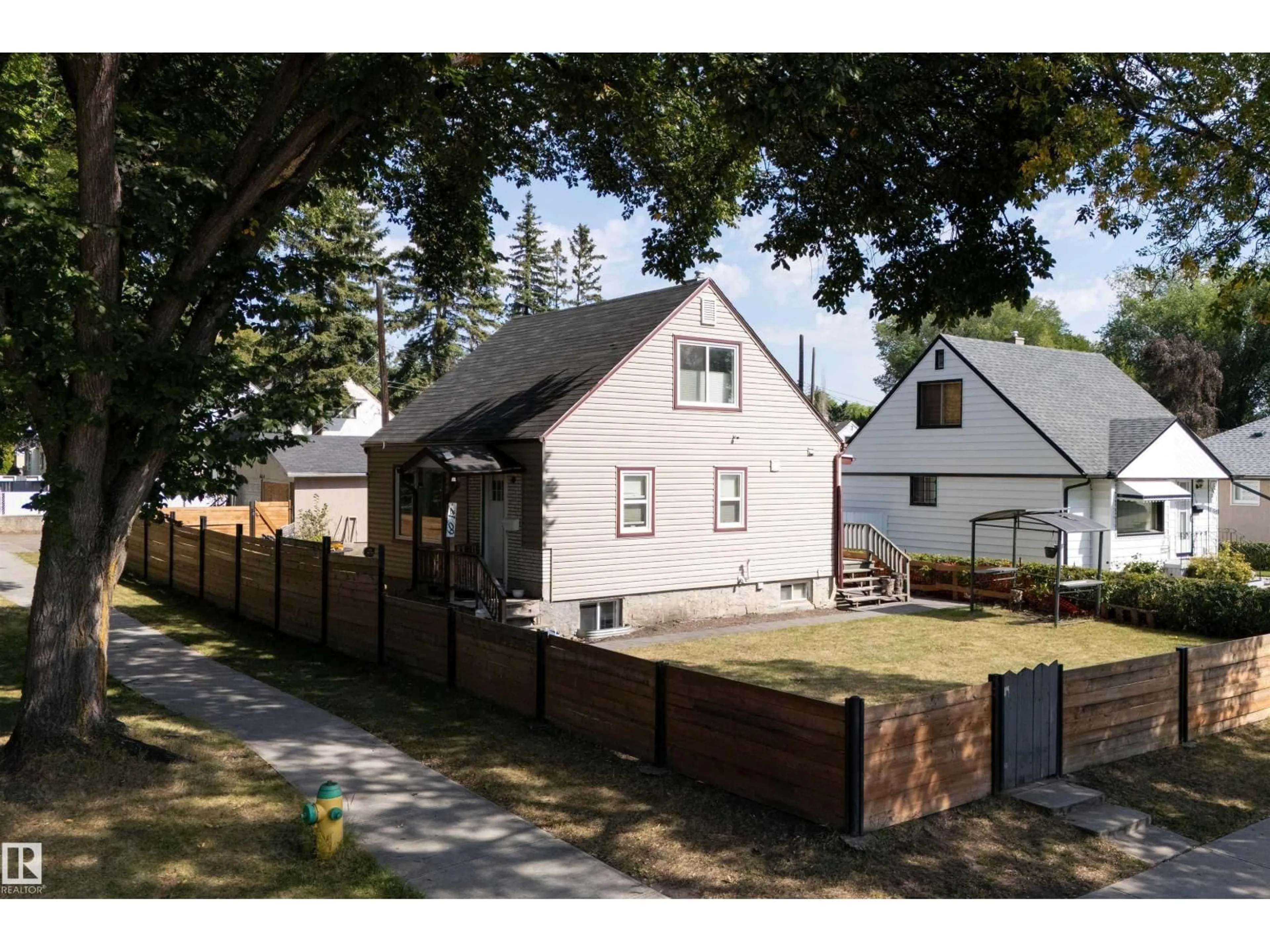 Home with brick exterior material, street for NW - 6014 120 AV, Edmonton Alberta T5W1L7