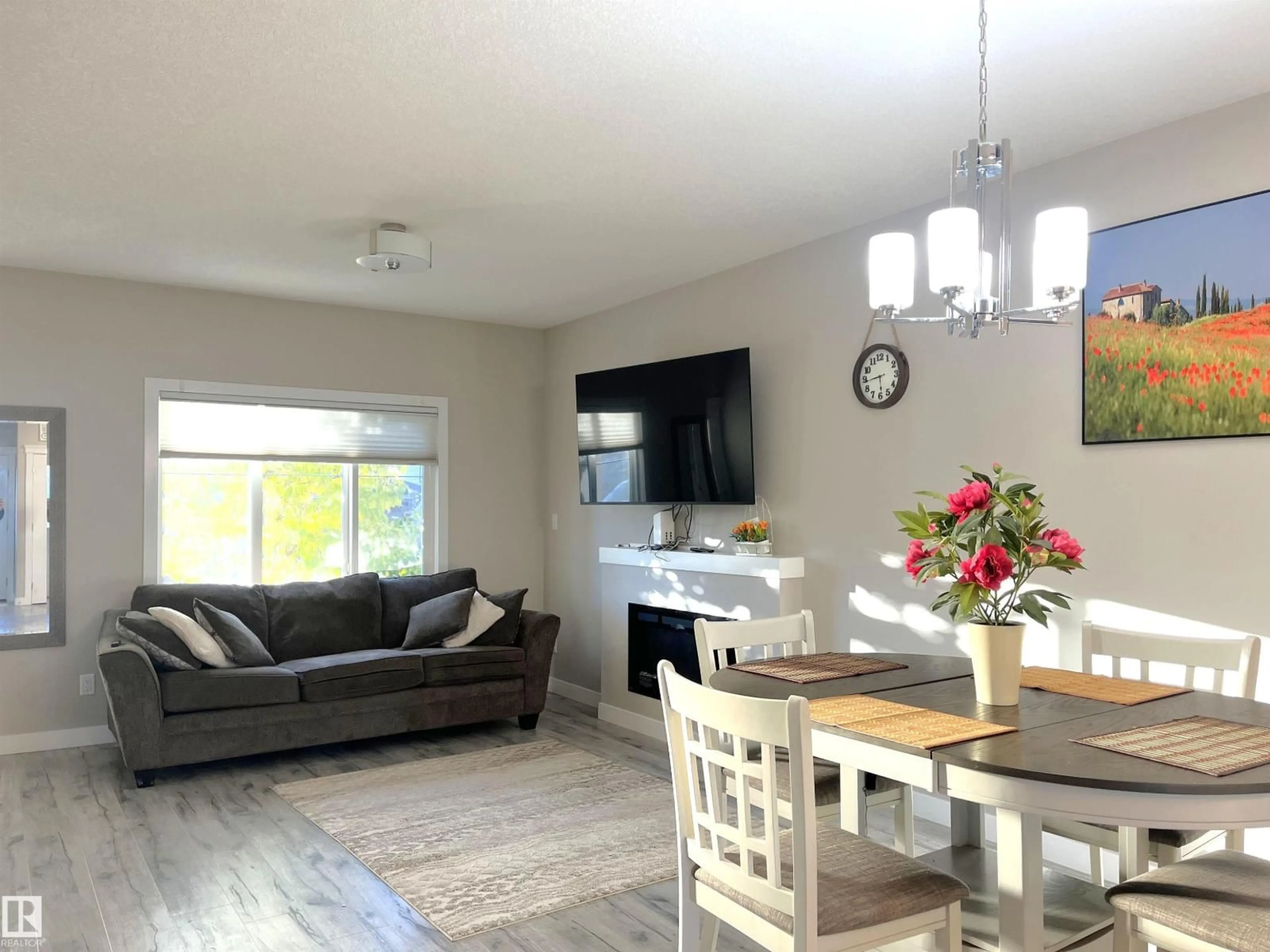 Living room with furniture, wood/laminate floor for 729 BERG LO, Leduc Alberta T9E1G8