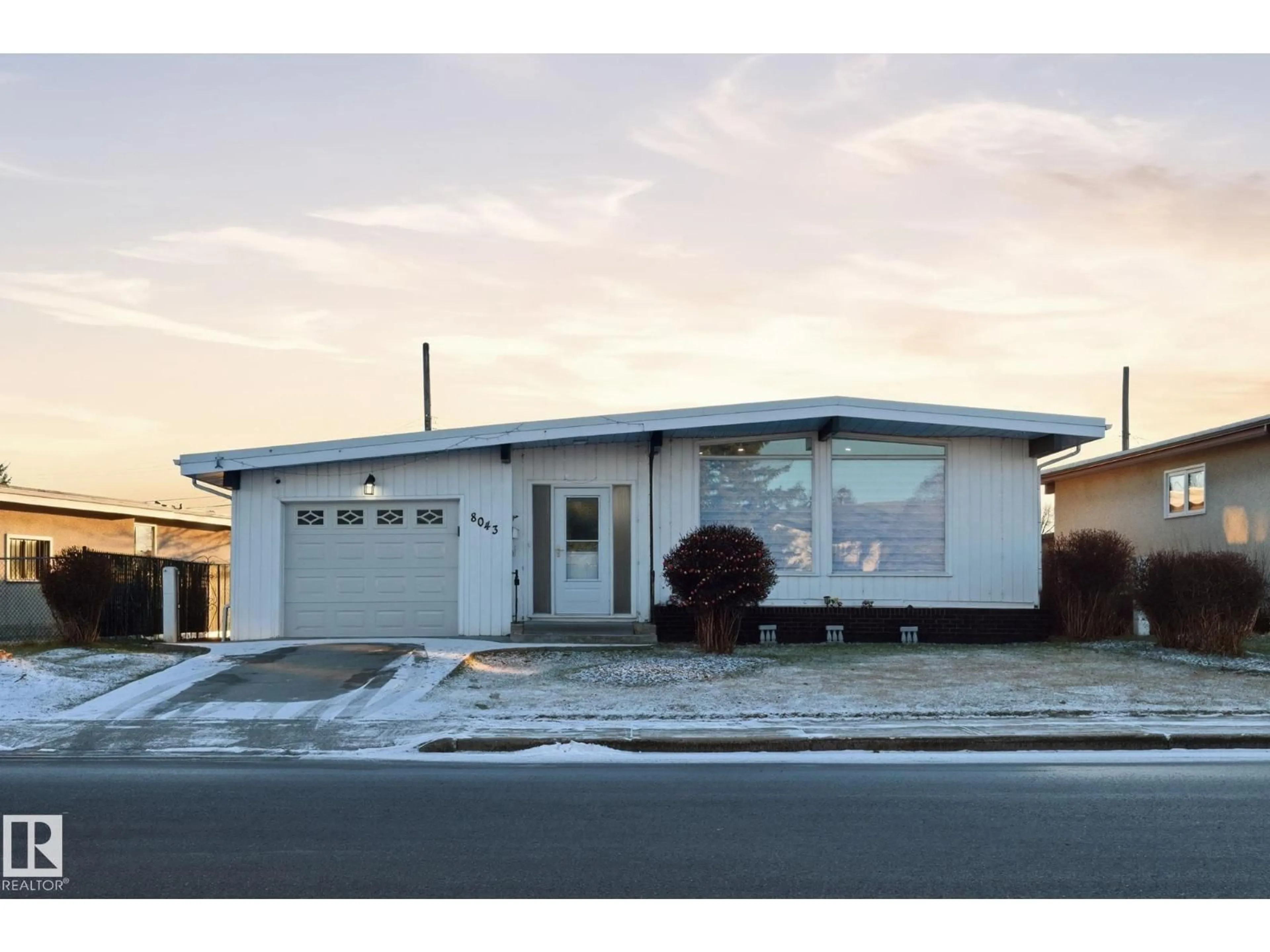 Home with vinyl exterior material, street for 8043 135 AV, Edmonton Alberta T5C2H3