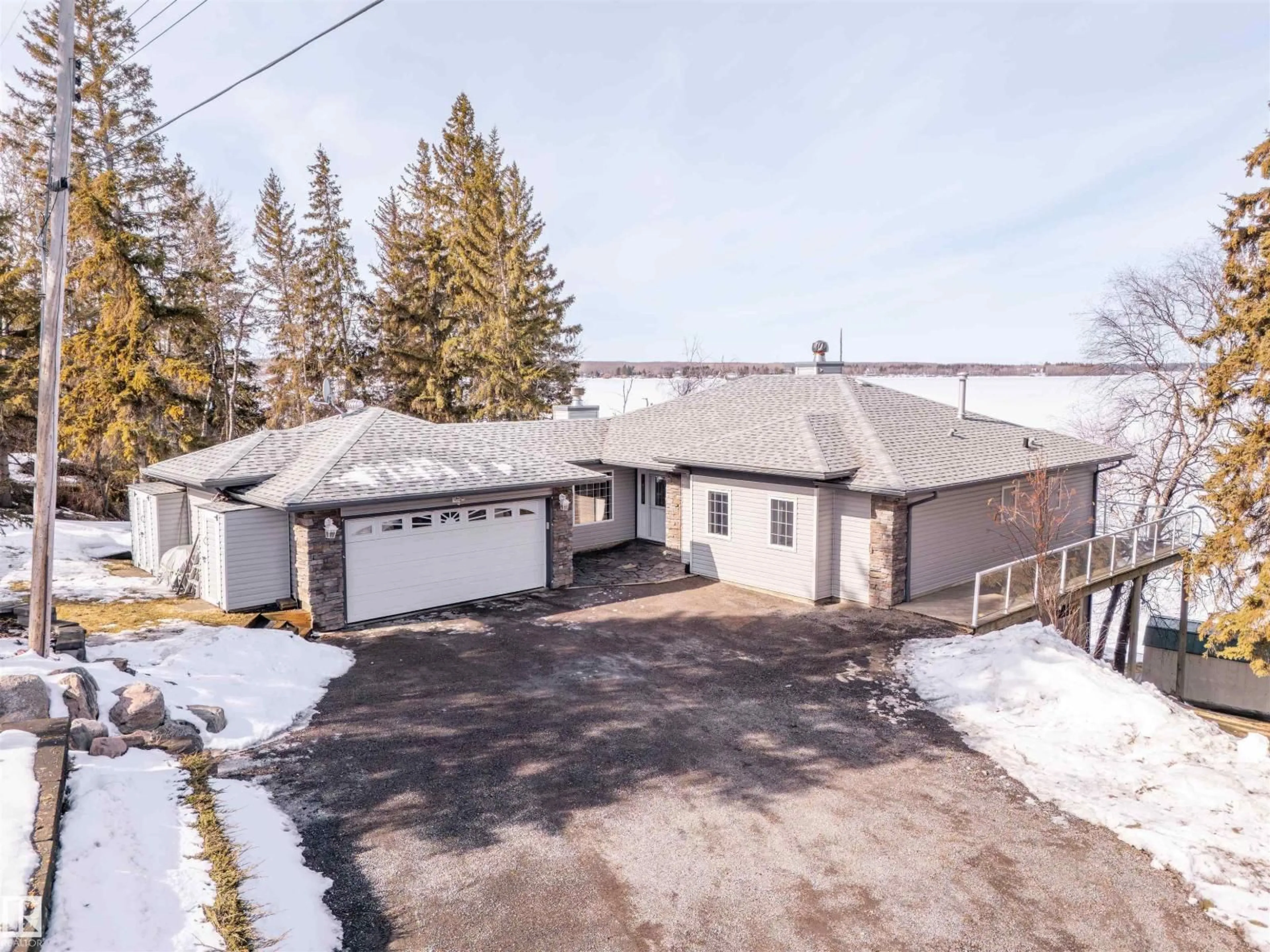 A pic from outside/outdoor area/front of a property/back of a property/a pic from drone, street for 61212 - 12 RR 463, Rural Bonnyville M.D. Alberta T9N2J3