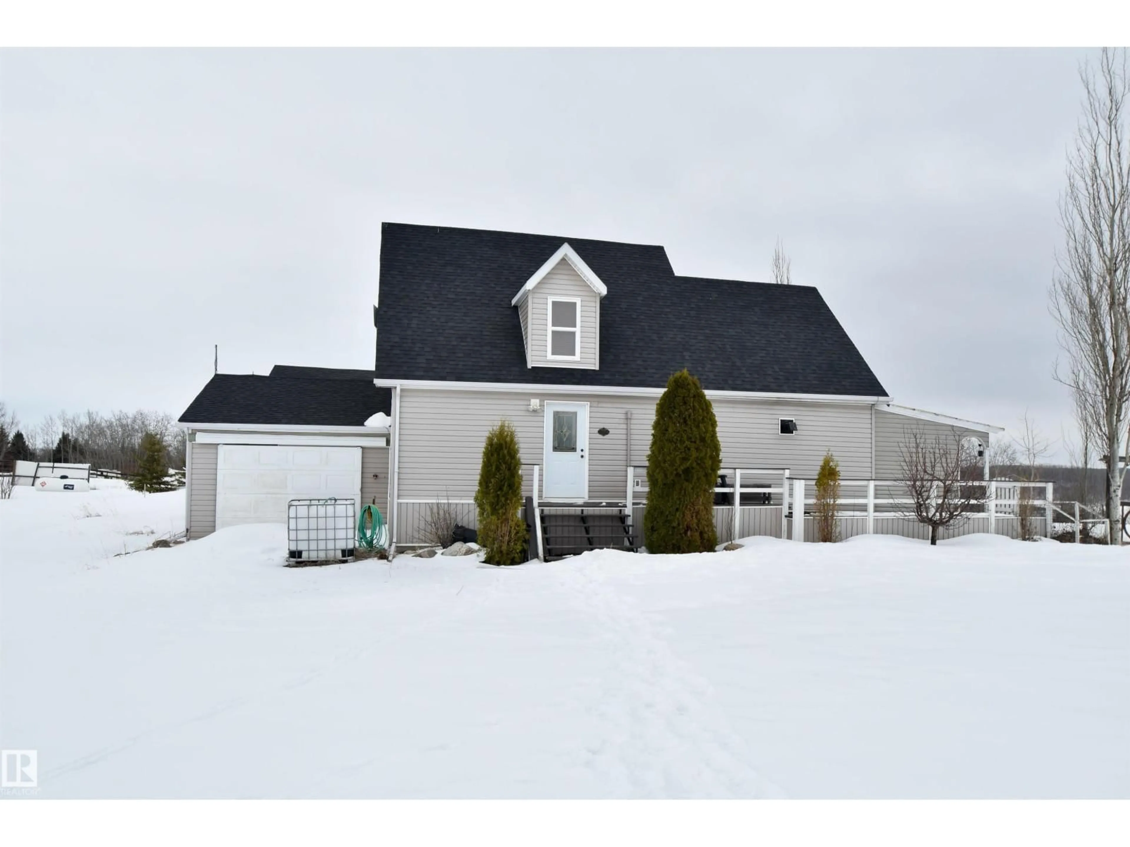 Home with vinyl exterior material, street for 57201 - 326 RR 102 RR, Rural St. Paul County Alberta T0A3A0