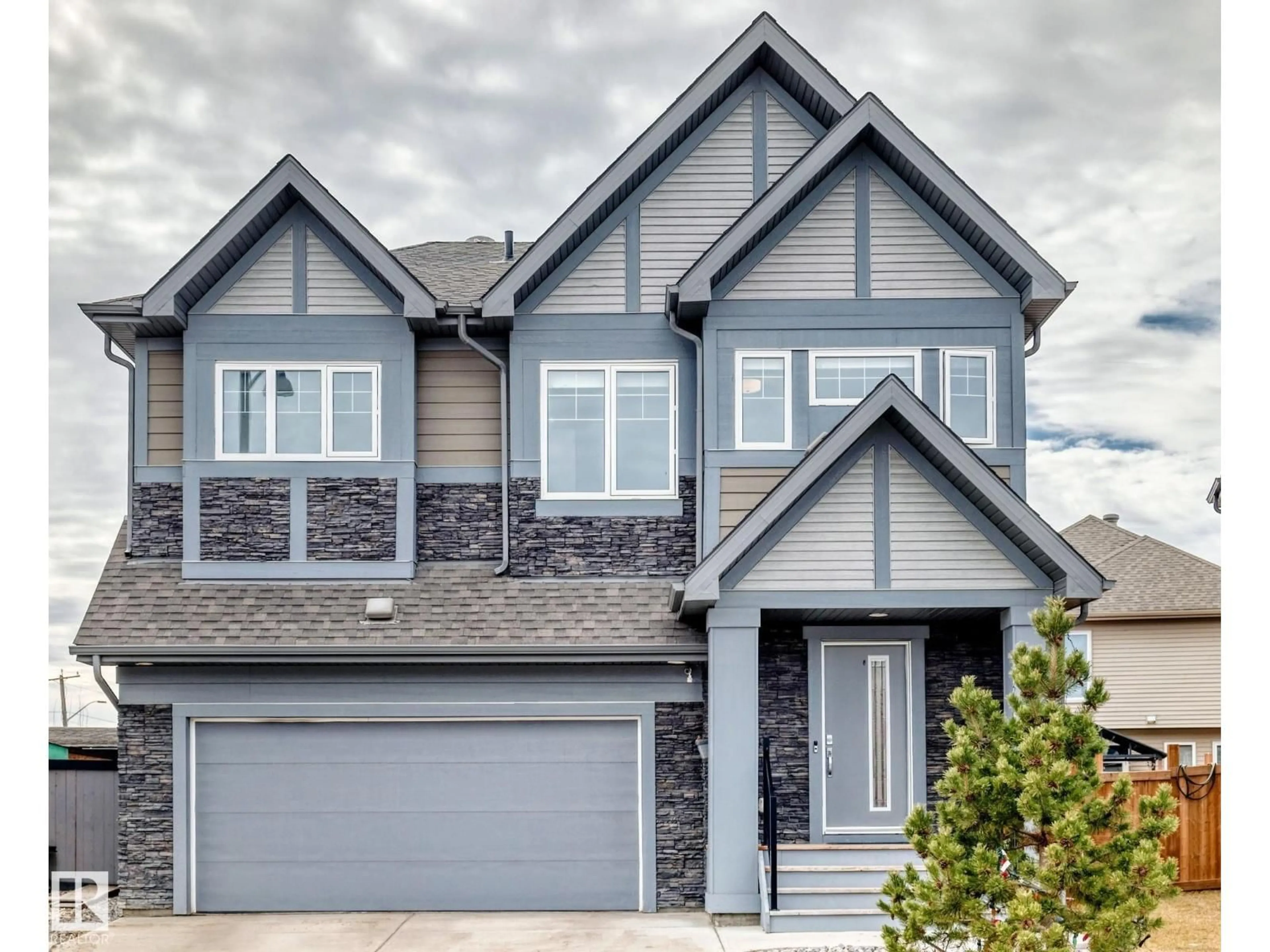 Home with vinyl exterior material, street for SW - 922 173A ST, Edmonton Alberta T6W3V3