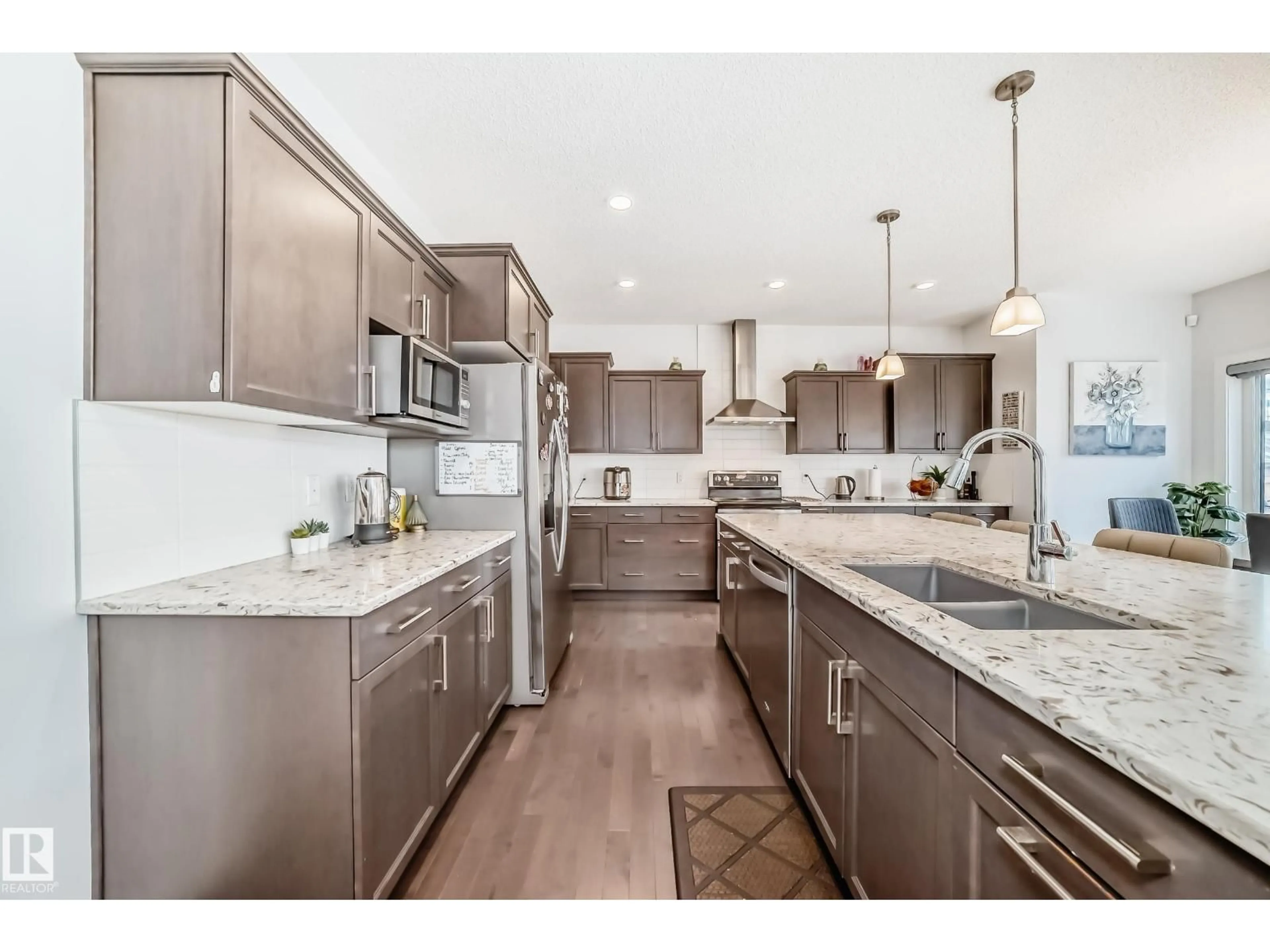 Open concept kitchen, ceramic/tile floor for SW - 922 173A ST, Edmonton Alberta T6W3V3