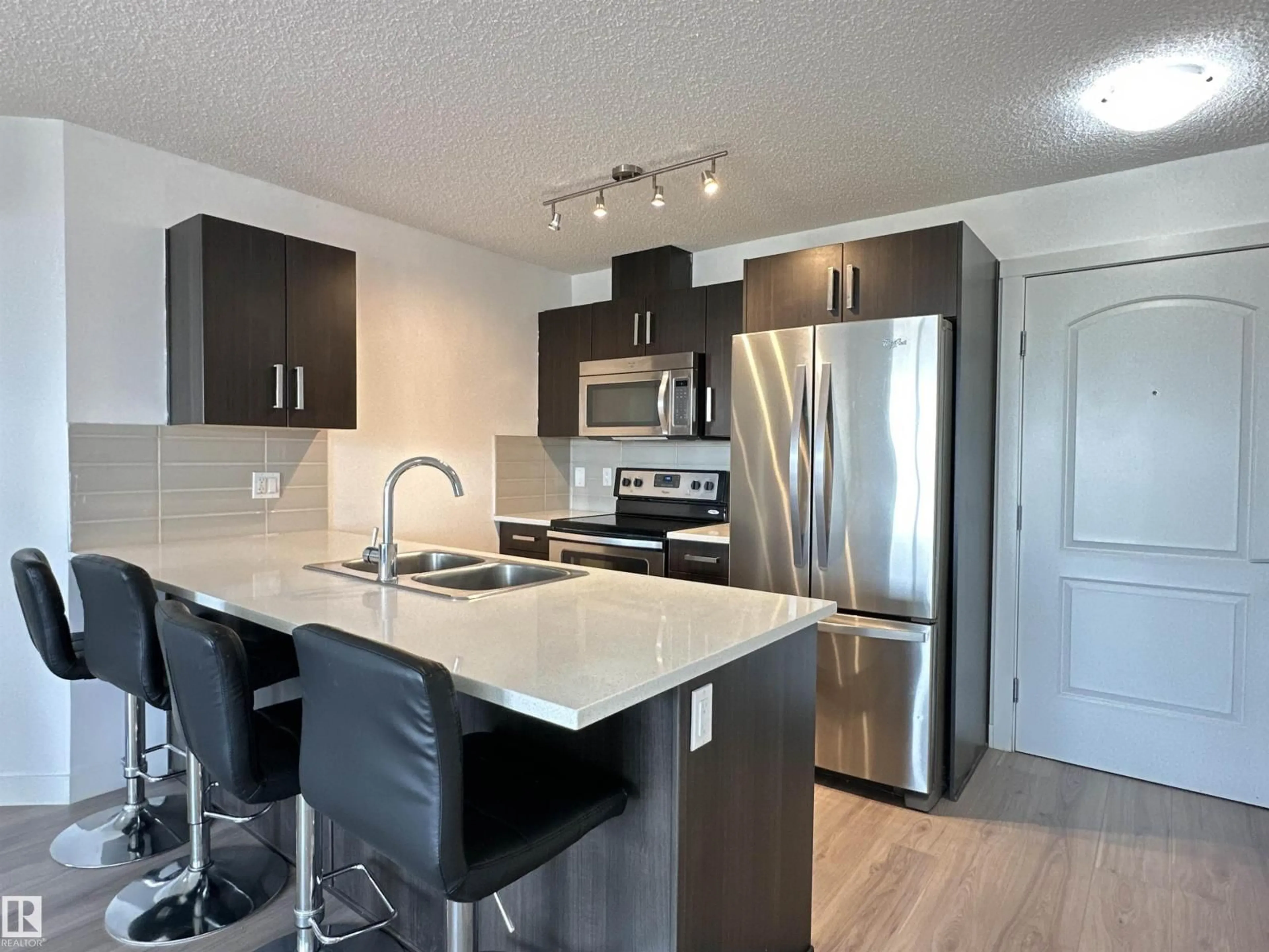 Open concept kitchen, unknown for 667 - 311 WATT BV, Edmonton Alberta T6X0Y2
