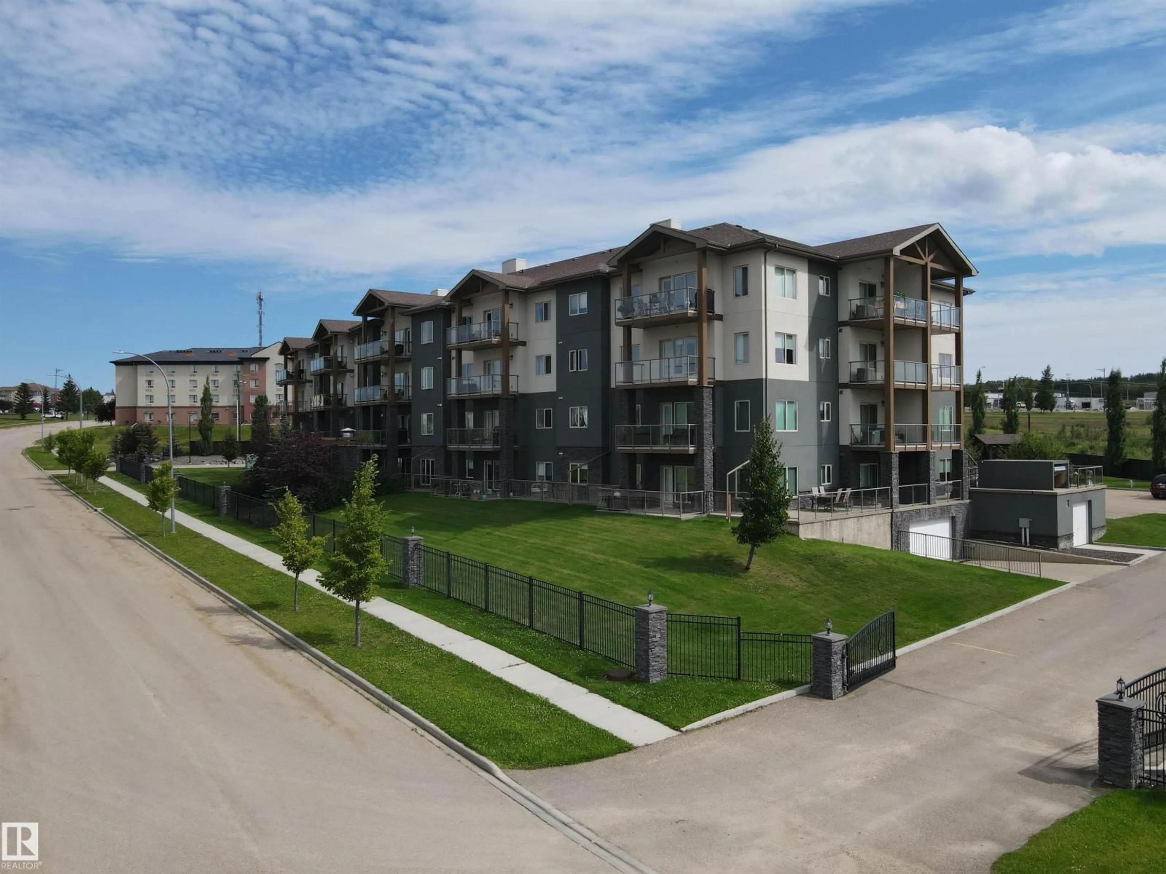 A pic from outside/outdoor area/front of a property/back of a property/a pic from drone, unknown for #304 - 5201 BROUGHAM DR, Drayton Valley Alberta T7A0C8