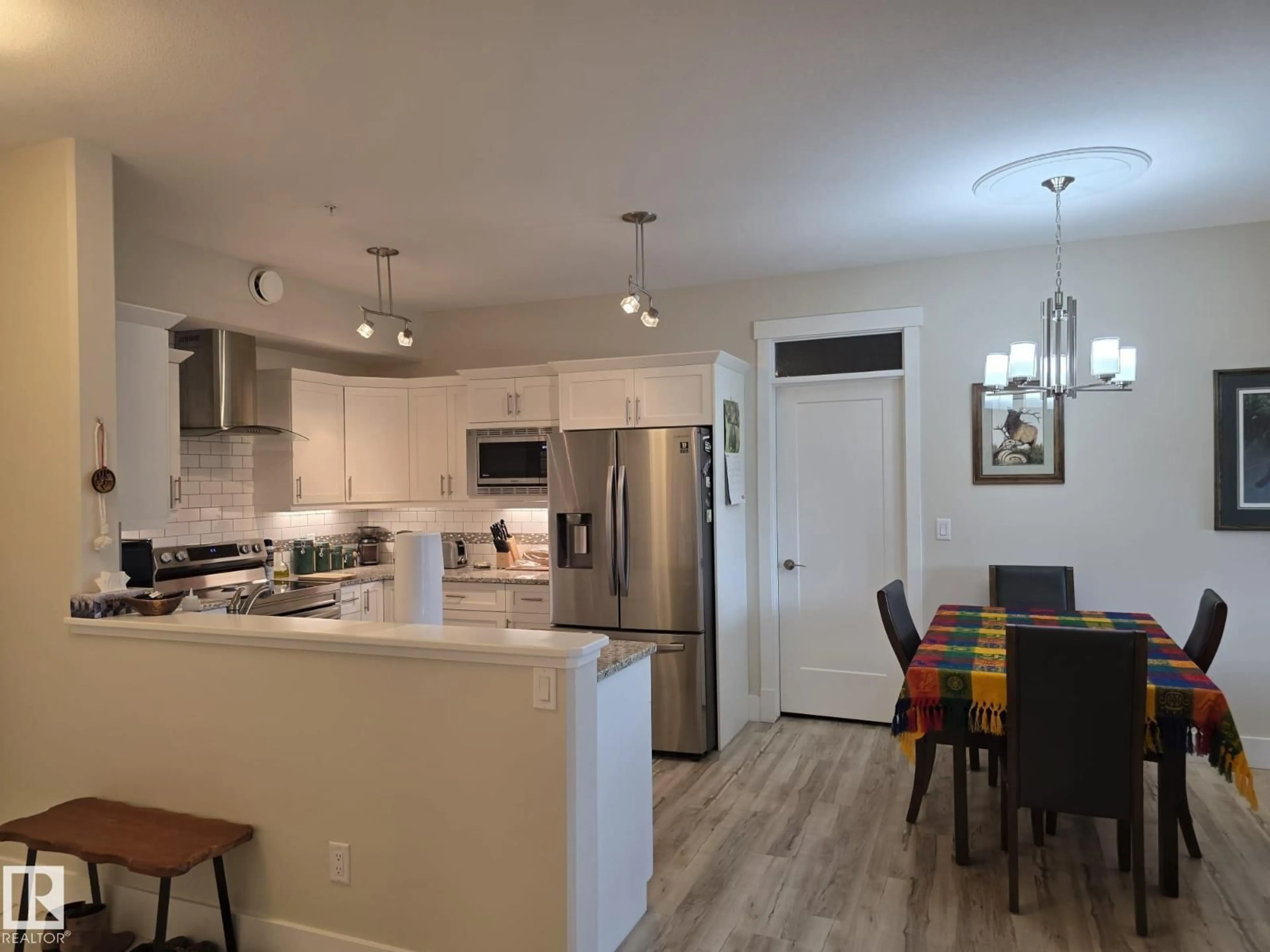 Open concept kitchen, wood/laminate floor for #304 - 5201 BROUGHAM DR, Drayton Valley Alberta T7A0C8