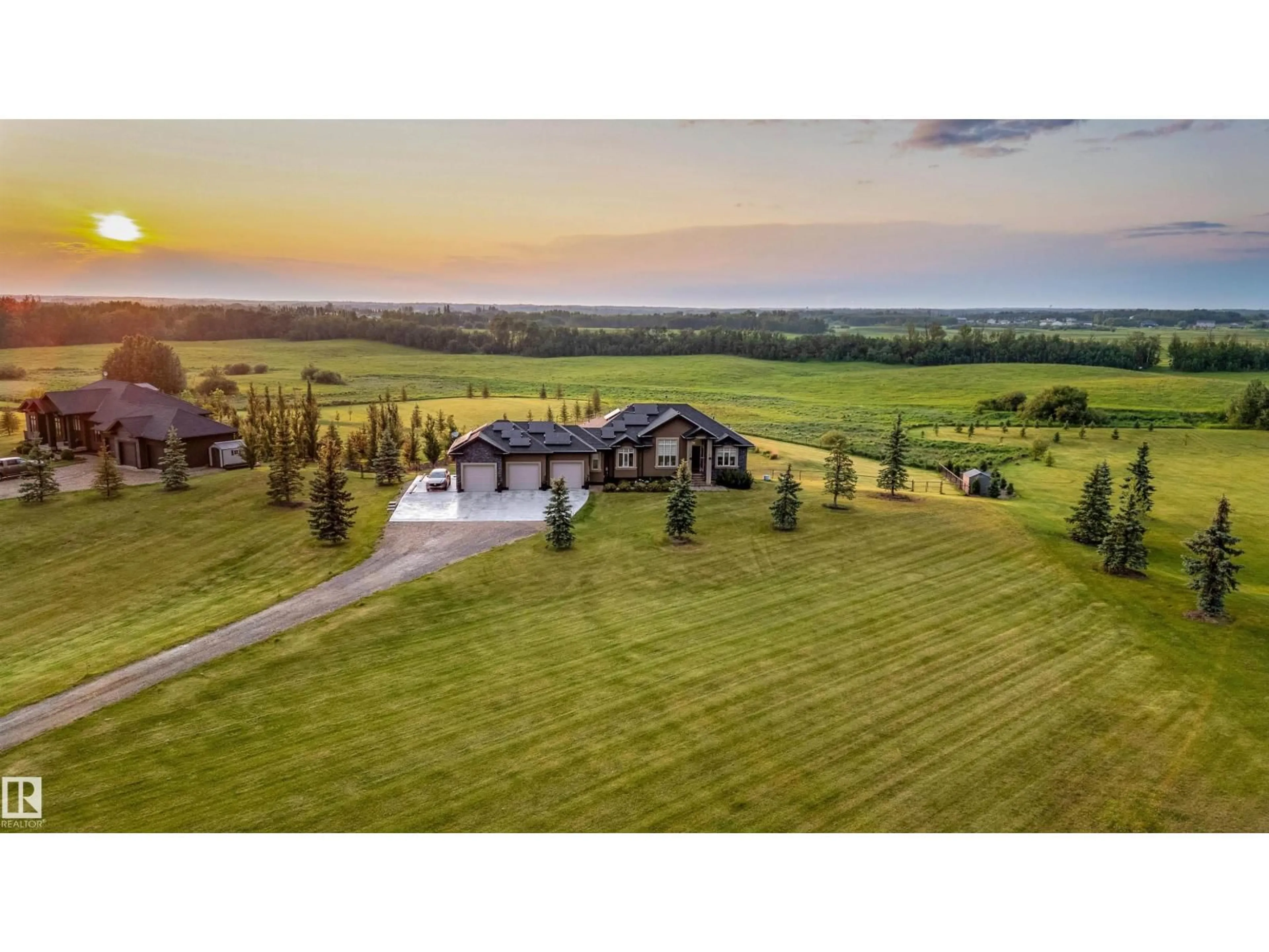 A pic from outside/outdoor area/front of a property/back of a property/a pic from drone, mountain view for 390 50054 RGE RD 232, Rural Leduc County Alberta T4X0K8