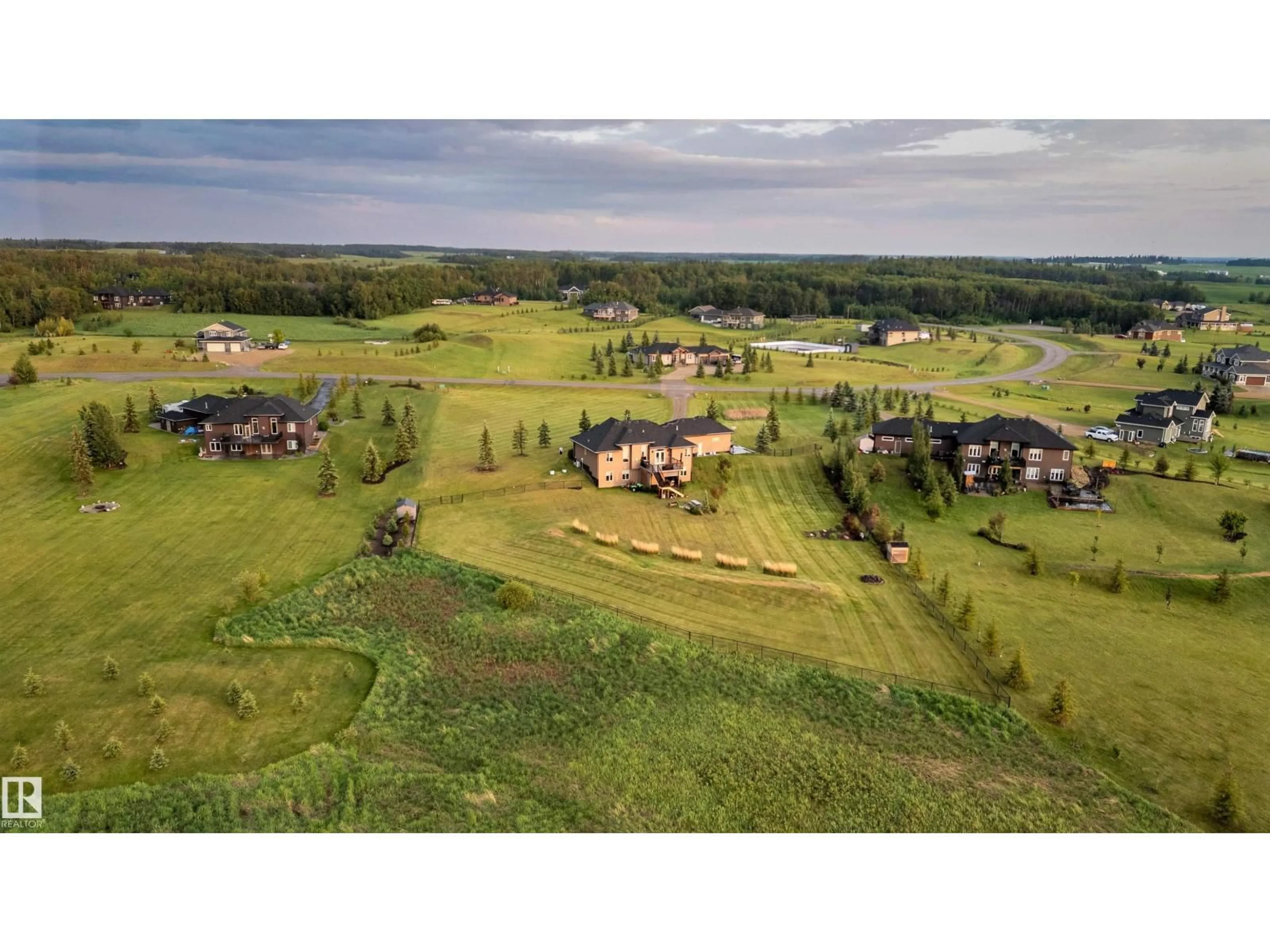 A pic from outside/outdoor area/front of a property/back of a property/a pic from drone, mountain view for 390 50054 RGE RD 232, Rural Leduc County Alberta T4X0K8