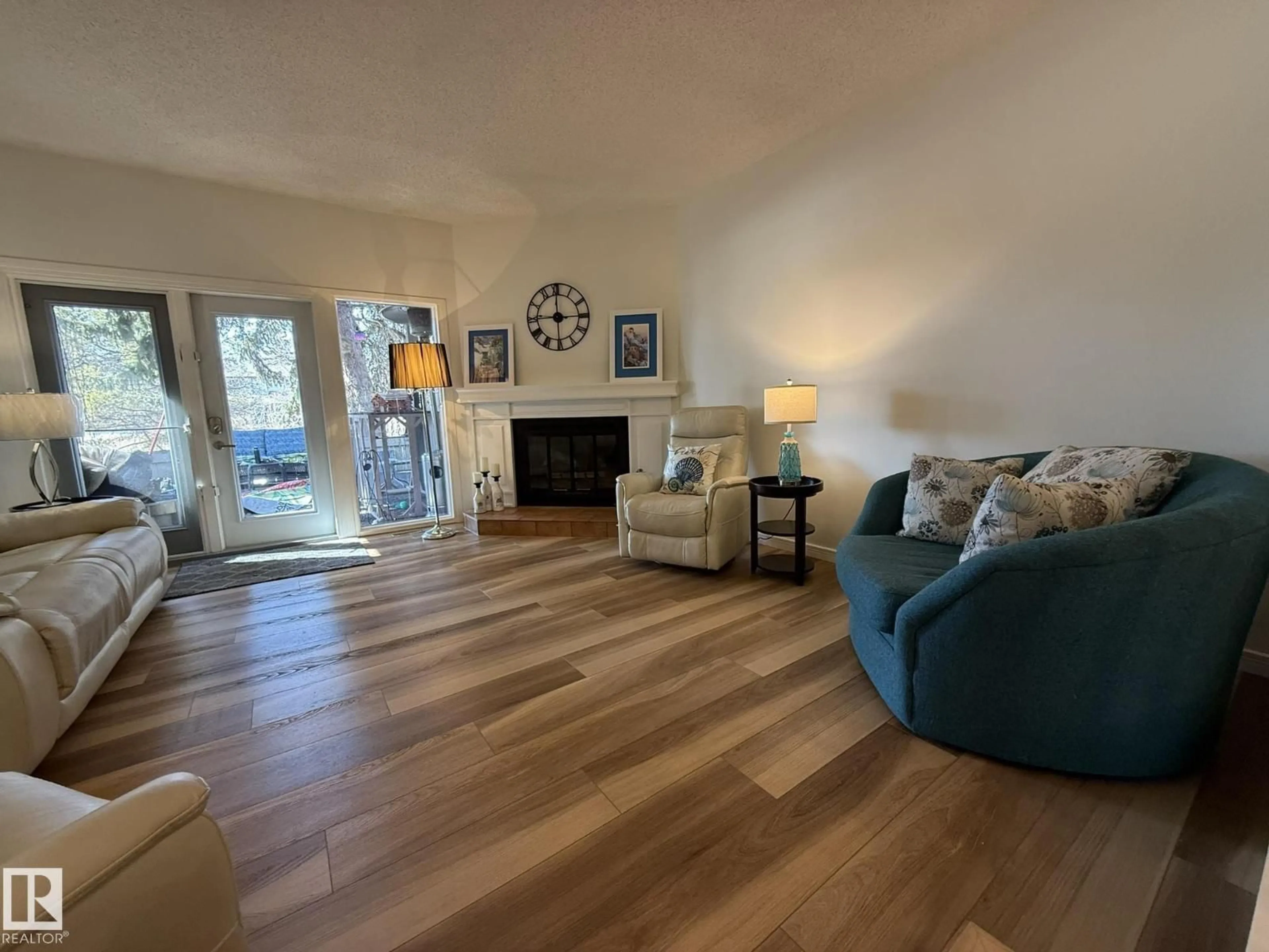 Living room with furniture, wood/laminate floor for 619 WOODBRIDGE WY, Sherwood Park Alberta T8A4E4