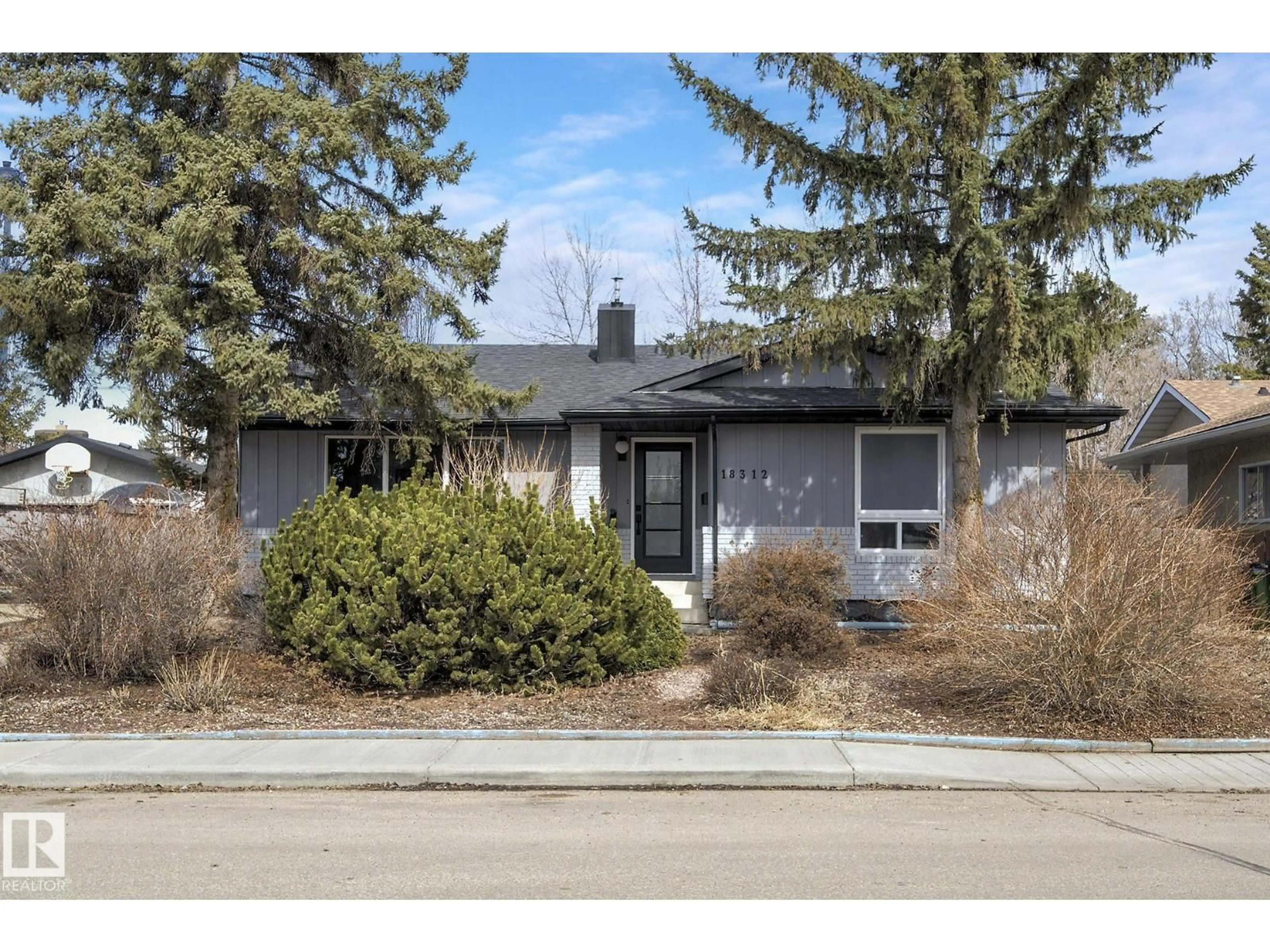 Home with vinyl exterior material, street for 18312 91 AV, Edmonton Alberta T5T1N9