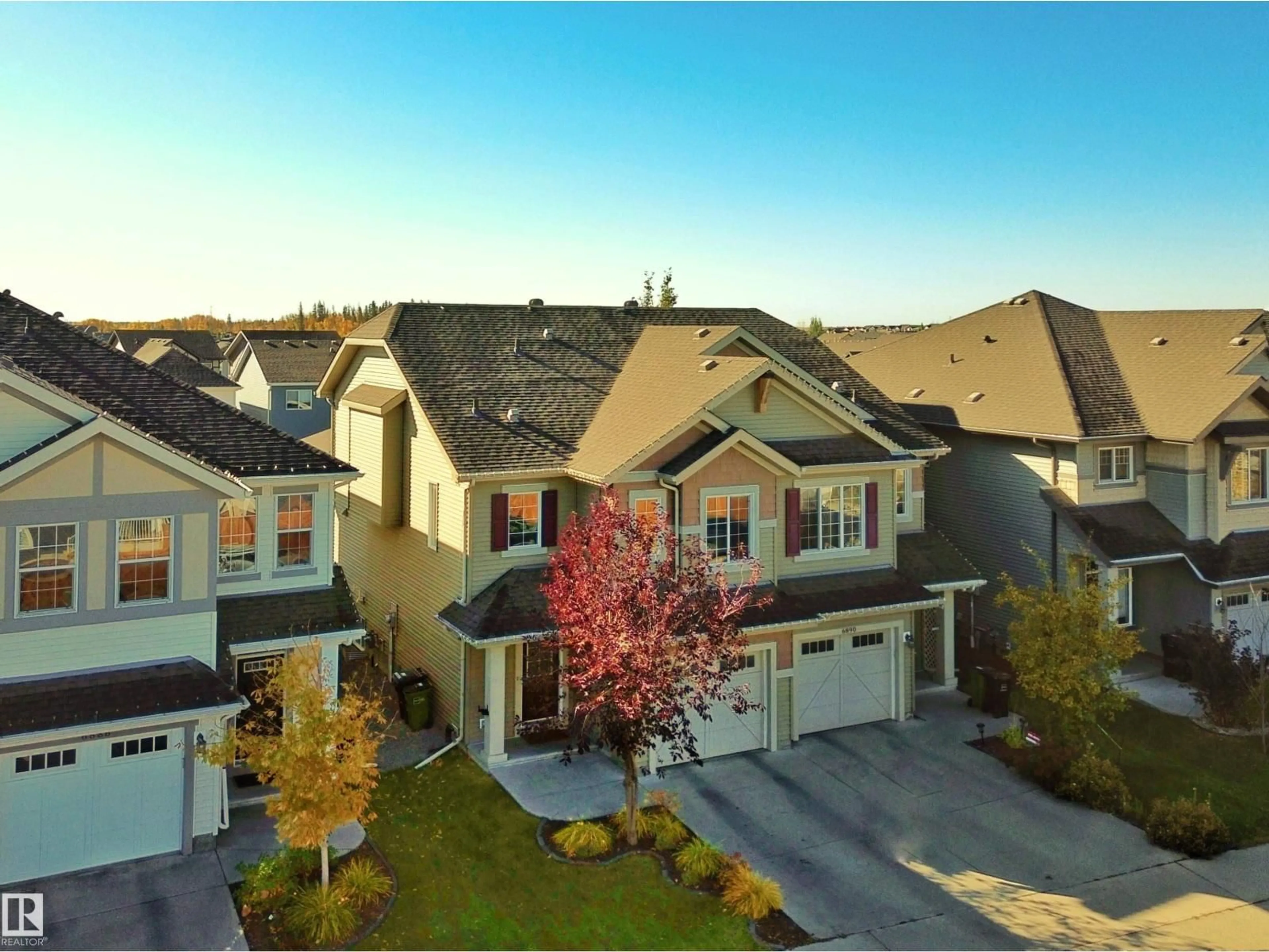 A pic from outside/outdoor area/front of a property/back of a property/a pic from drone, street for 6888 EVANS WD, Edmonton Alberta T6M0T8