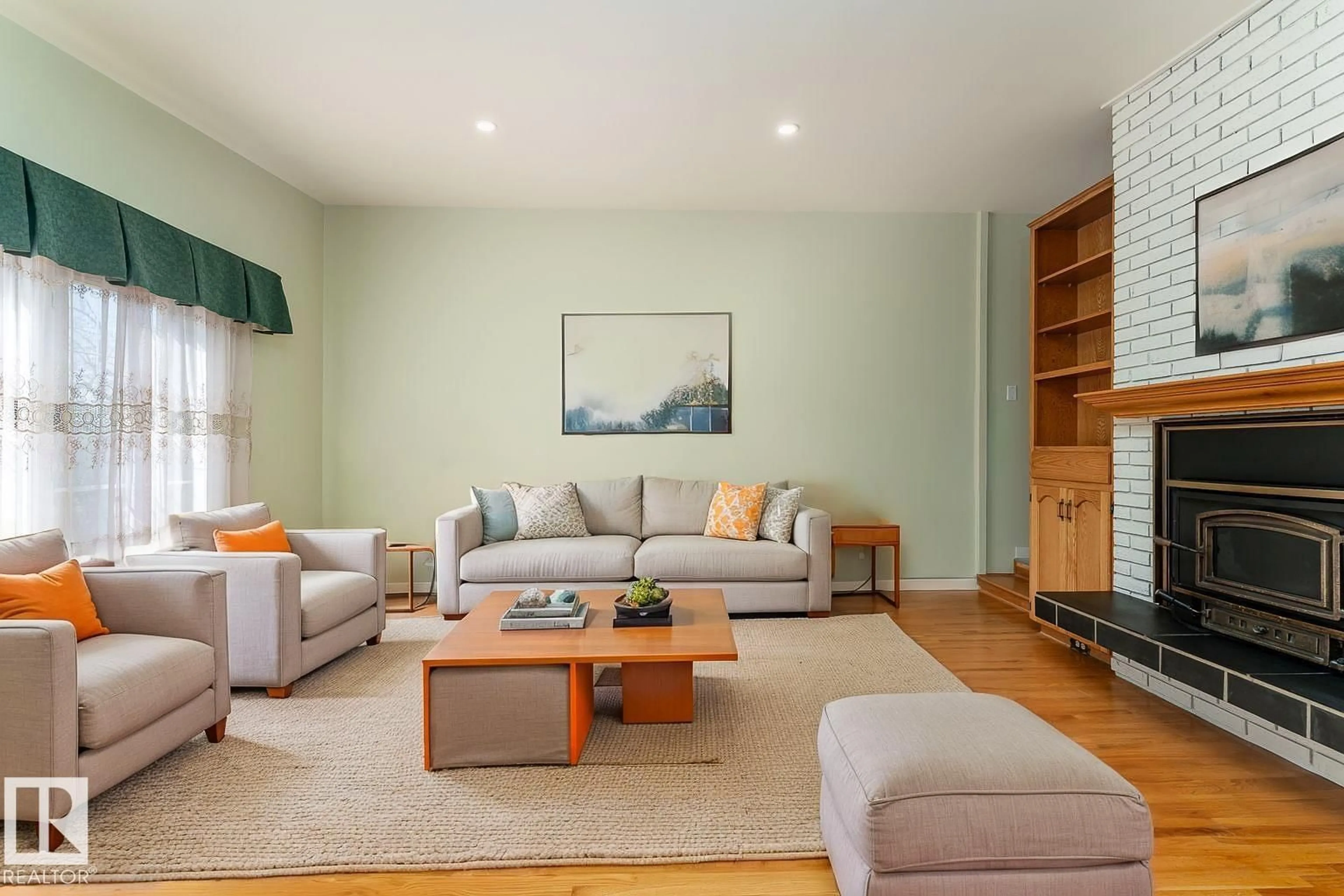 Living room with furniture, wood/laminate floor for NW - 9523 134 AV, Edmonton Alberta T5E1H8