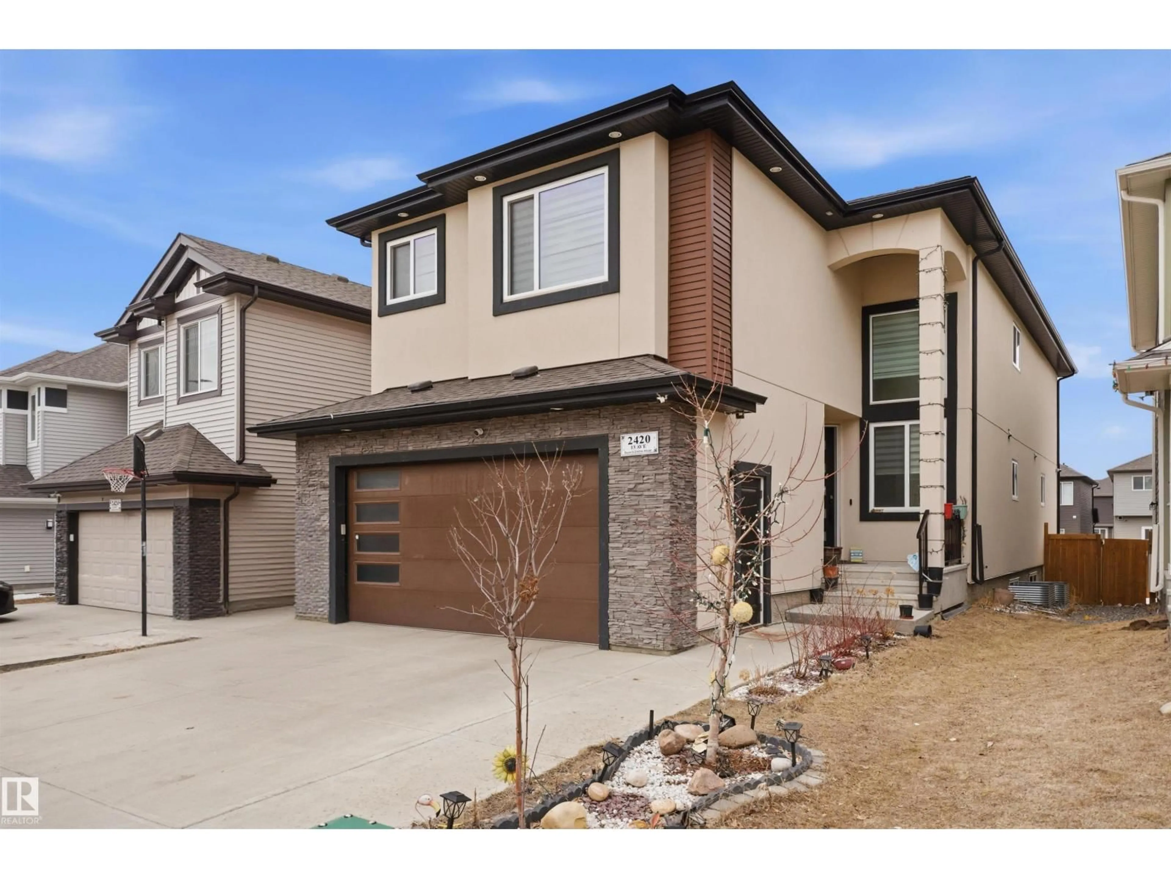Home with brick exterior material, street for 2420 13 AV, Edmonton Alberta T6T2M7