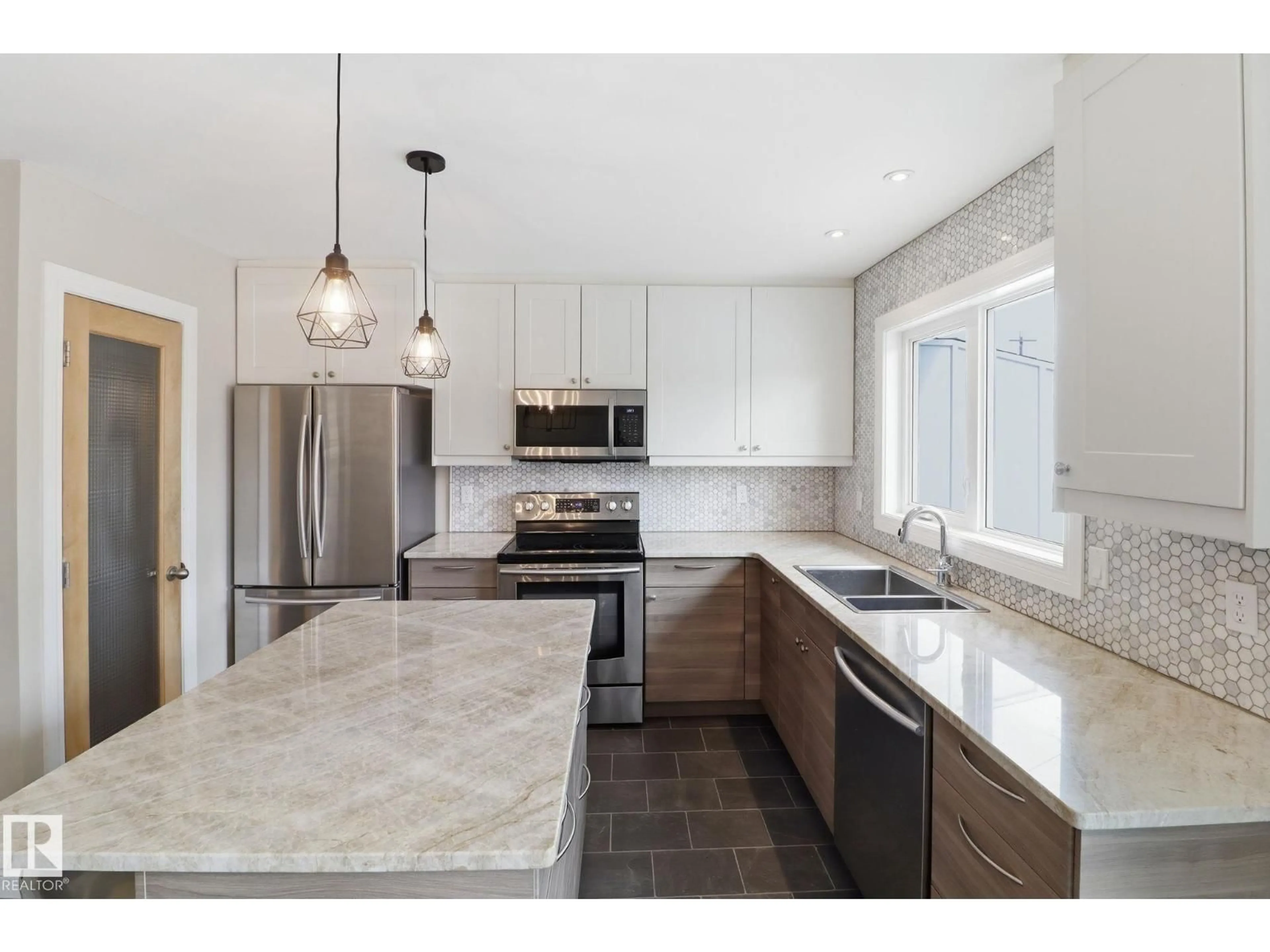Open concept kitchen, ceramic/tile floor for 9023 95 ST, Edmonton Alberta T6C3W7