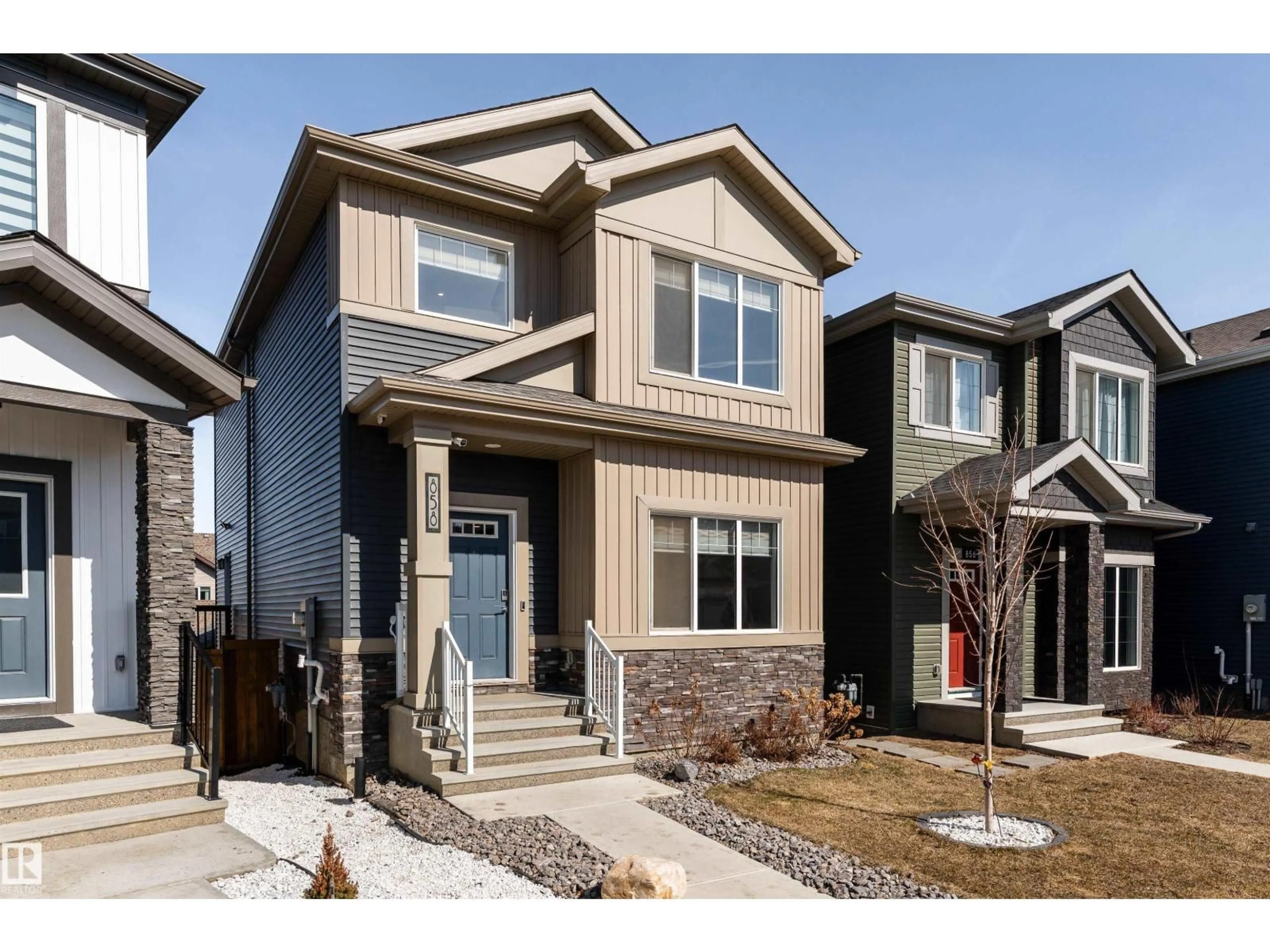 Home with vinyl exterior material, street for 858 NORTHERN HARRIER LN, Edmonton Alberta T5S0P8