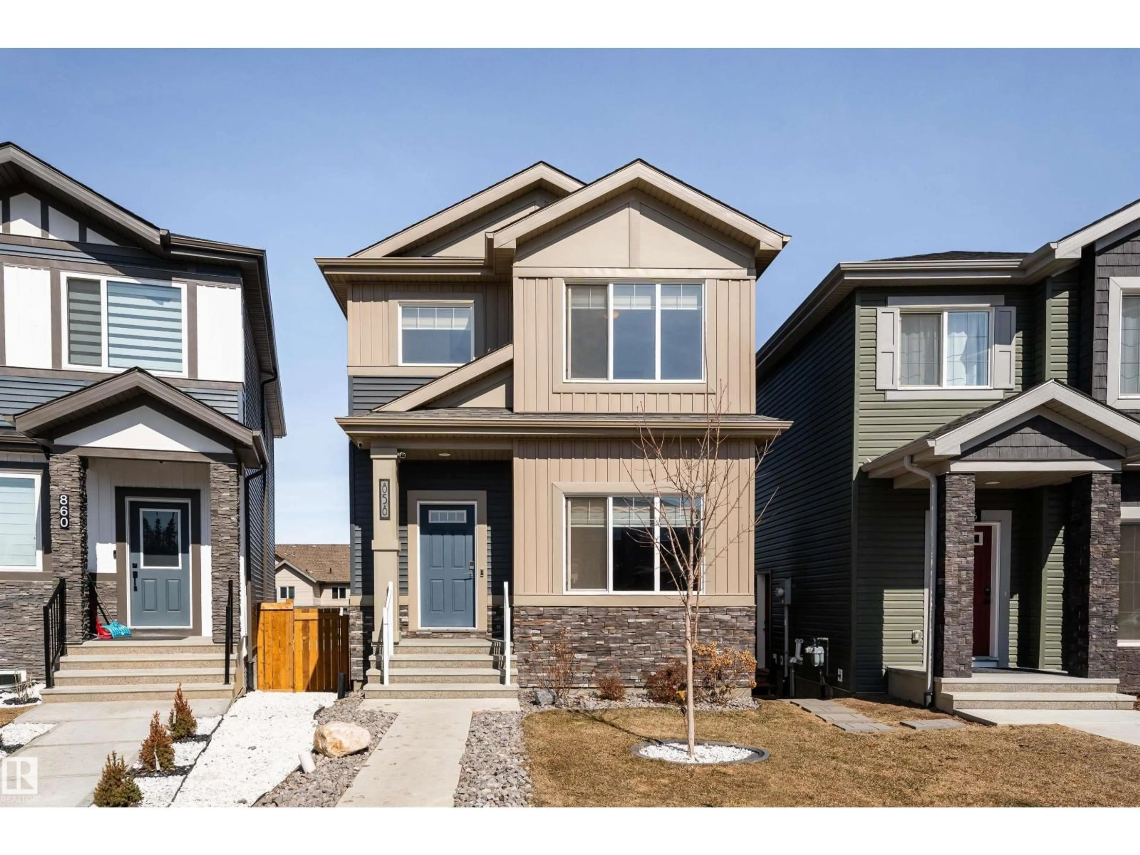 Home with vinyl exterior material, street for 858 NORTHERN HARRIER LN, Edmonton Alberta T5S0P8