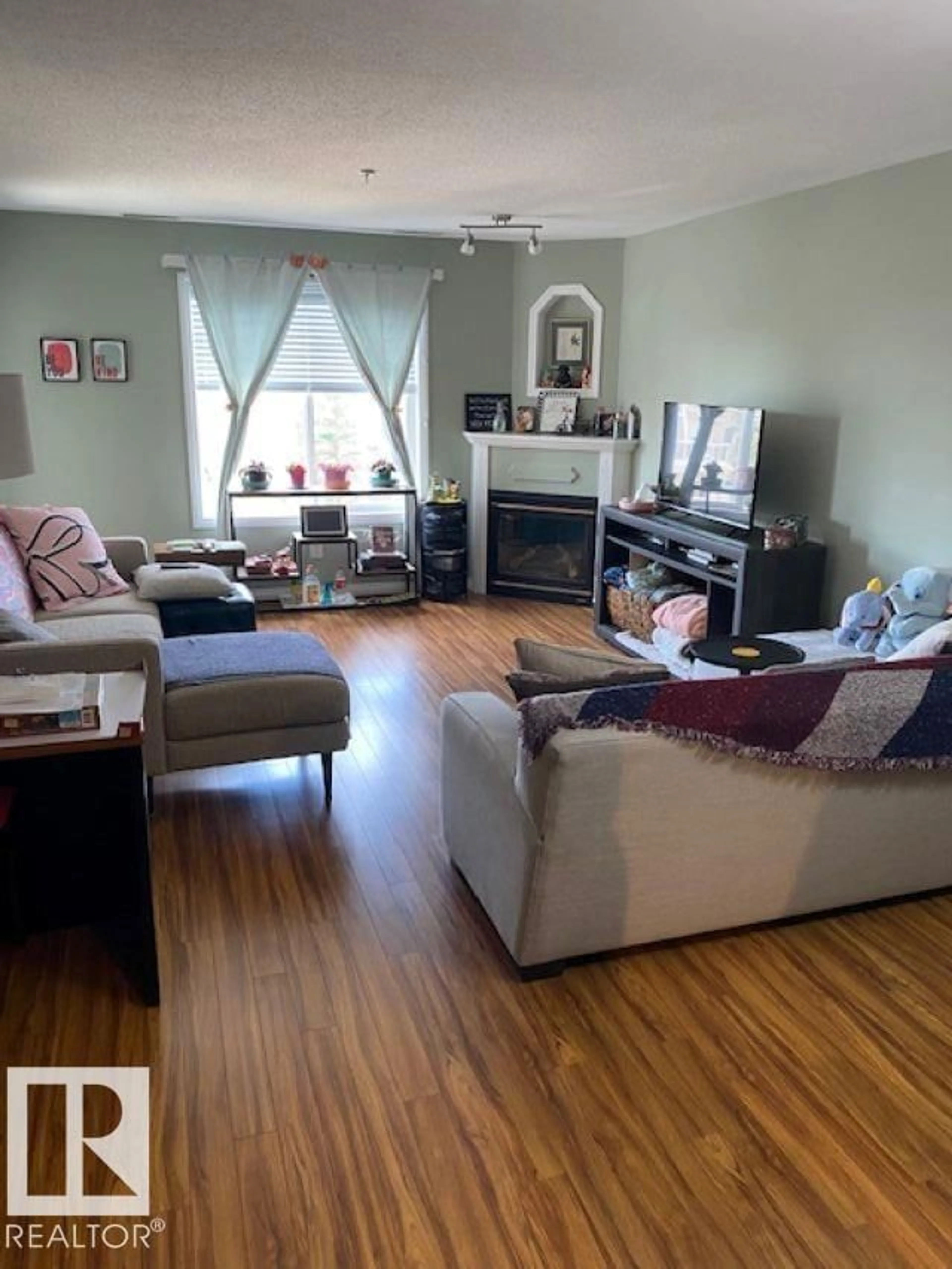 Living room with furniture, wood/laminate floor for 404 73 A MCKENNEY AV, St. Albert Alberta T8N7E6
