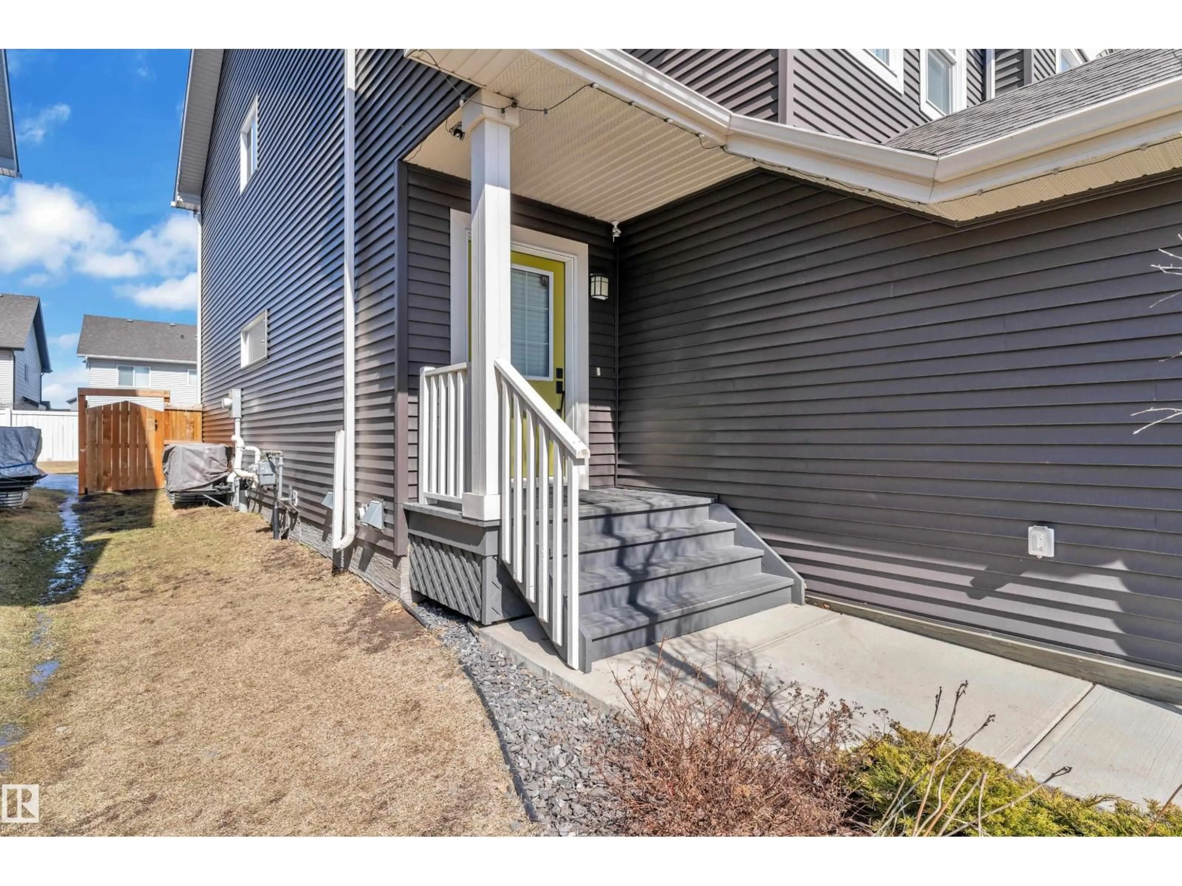 Home with vinyl exterior material, street for 6406 169 AV, Edmonton Alberta T5Y3W6