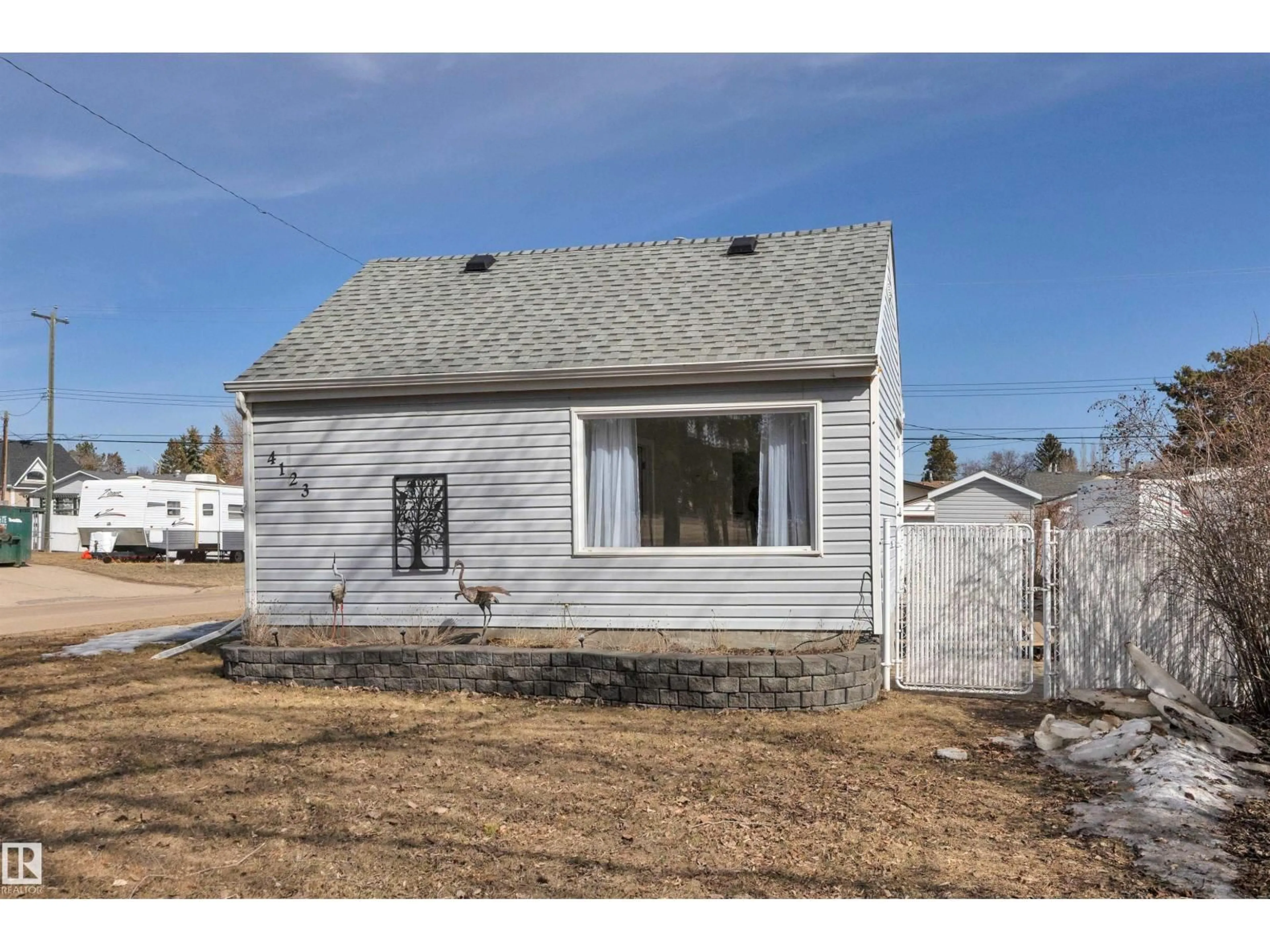 Home with vinyl exterior material, street for 4123 53A ST, Wetaskiwin Alberta T9A1S2