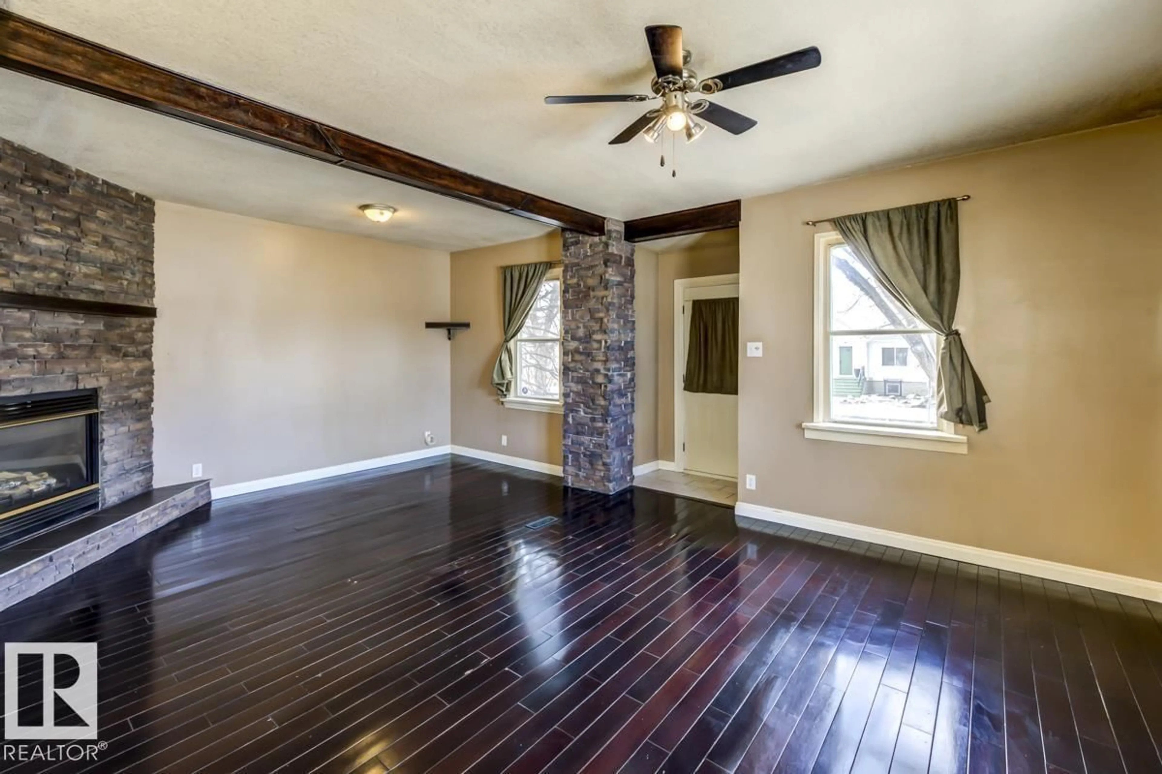 Living room with furniture, wood/laminate floor for 6015 106 ST, Edmonton Alberta T6H2T5