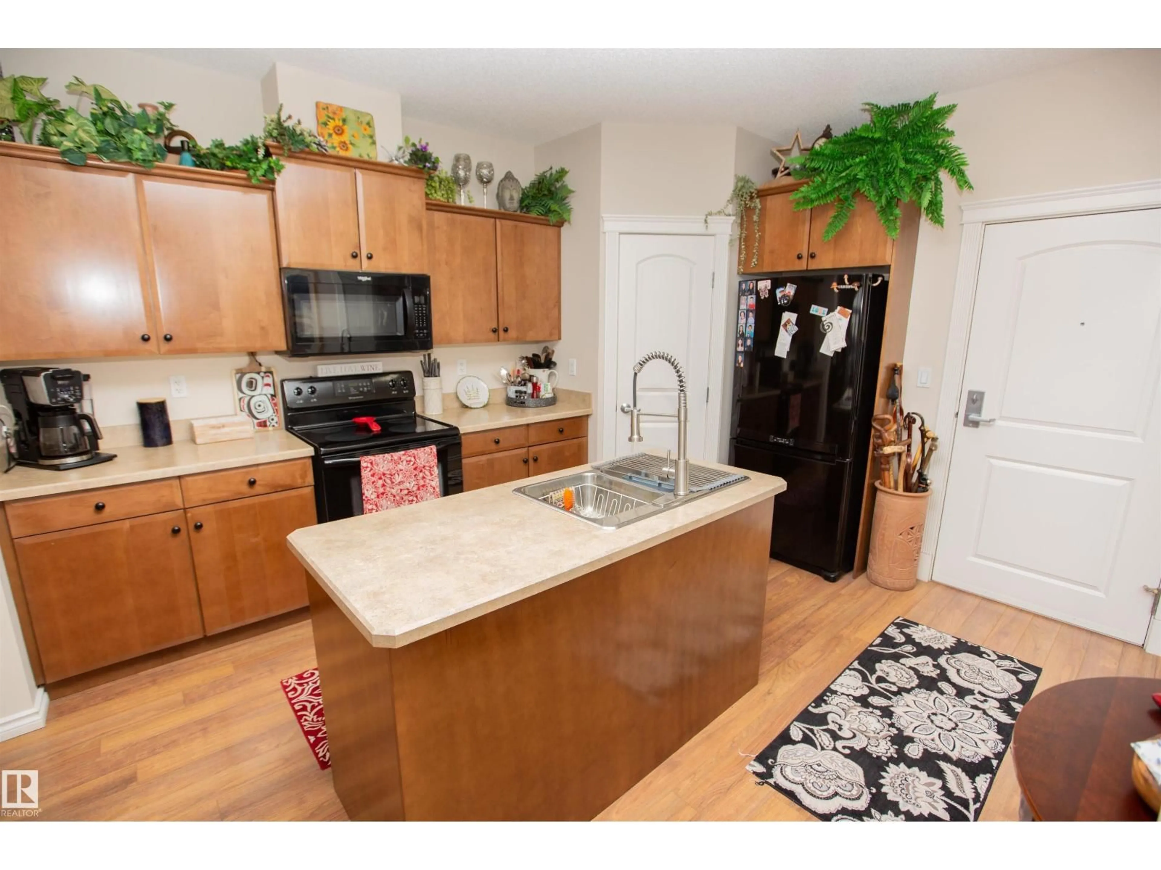 Open concept kitchen, wood/laminate floor for 404 - 9820 165 ST, Edmonton Alberta T5P0N3