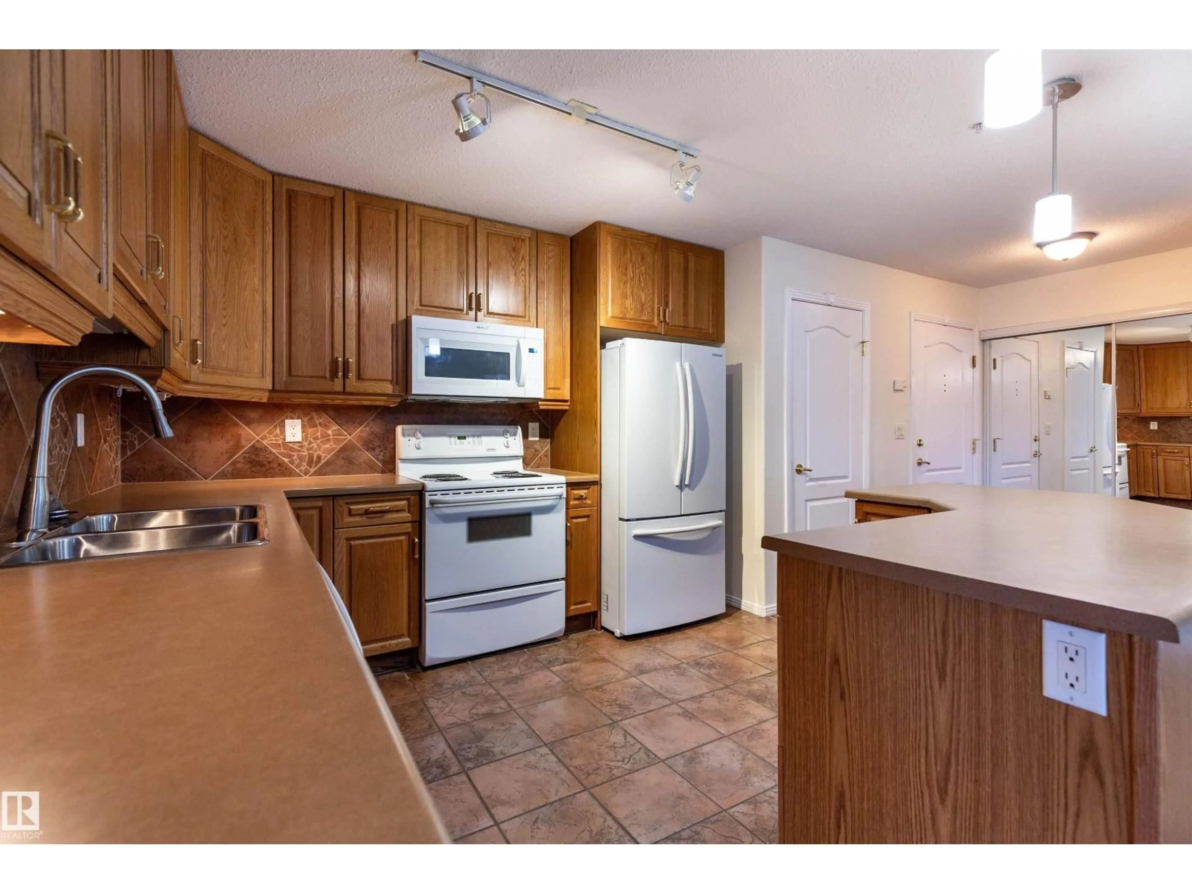 Standard kitchen, unknown for #105 - 8912 156 ST, Edmonton Alberta T5R5Z2