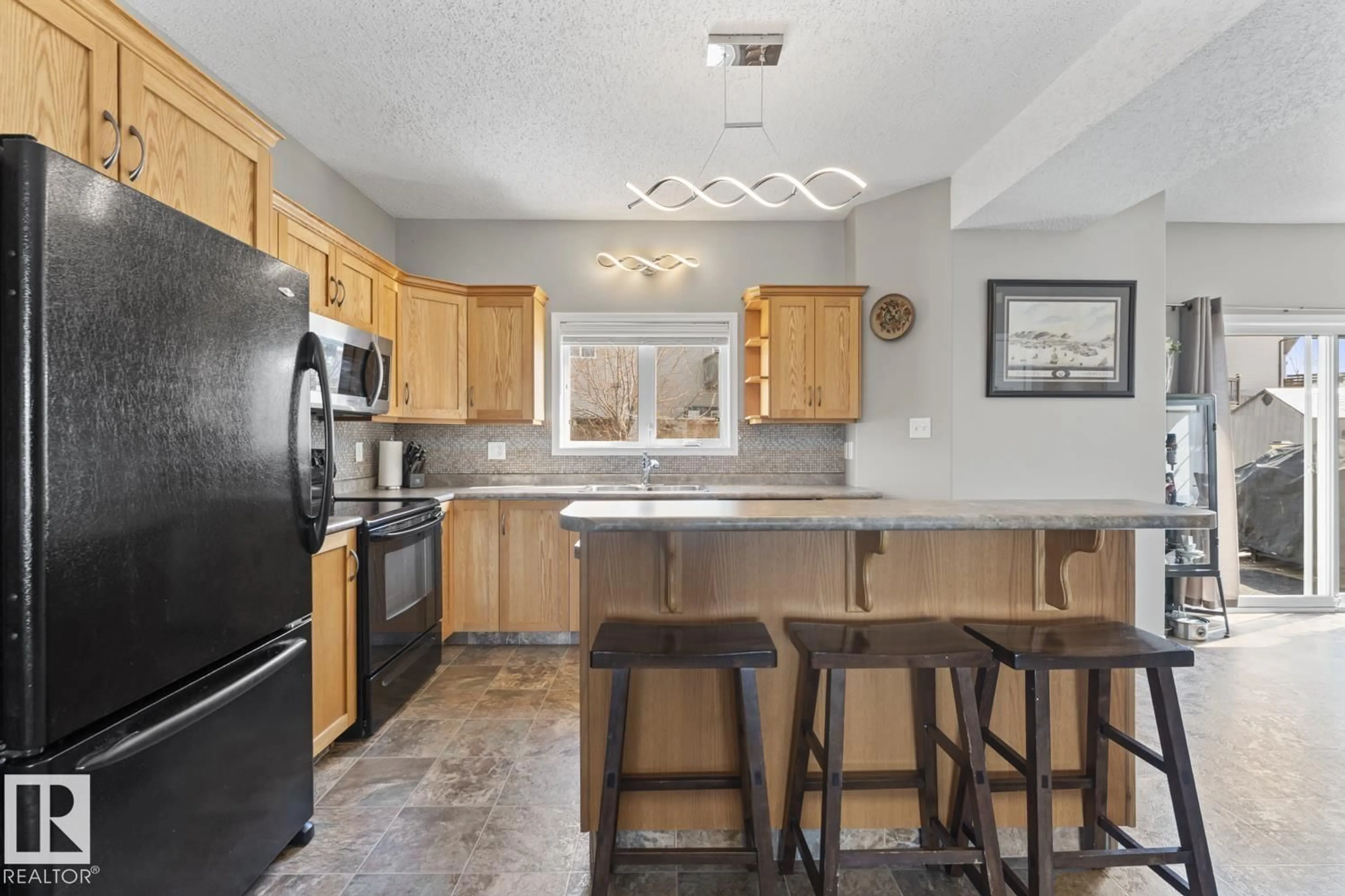 Open concept kitchen, ceramic/tile floor for 706 ROBIN CL, Cold Lake Alberta T9M2B7