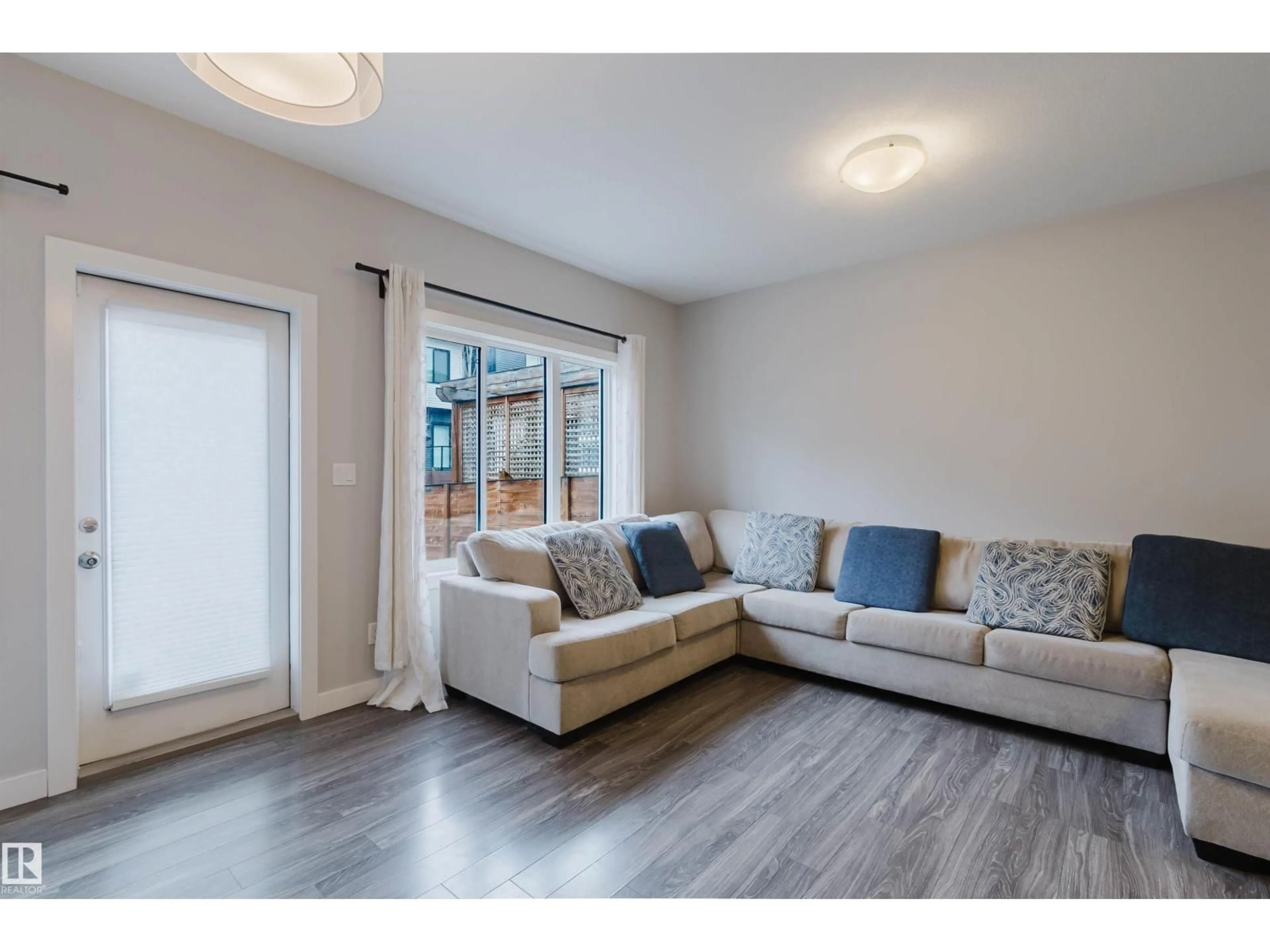 Living room with furniture, wood/laminate floor for SW - 1793 KEENE CR, Edmonton Alberta T6W3W3