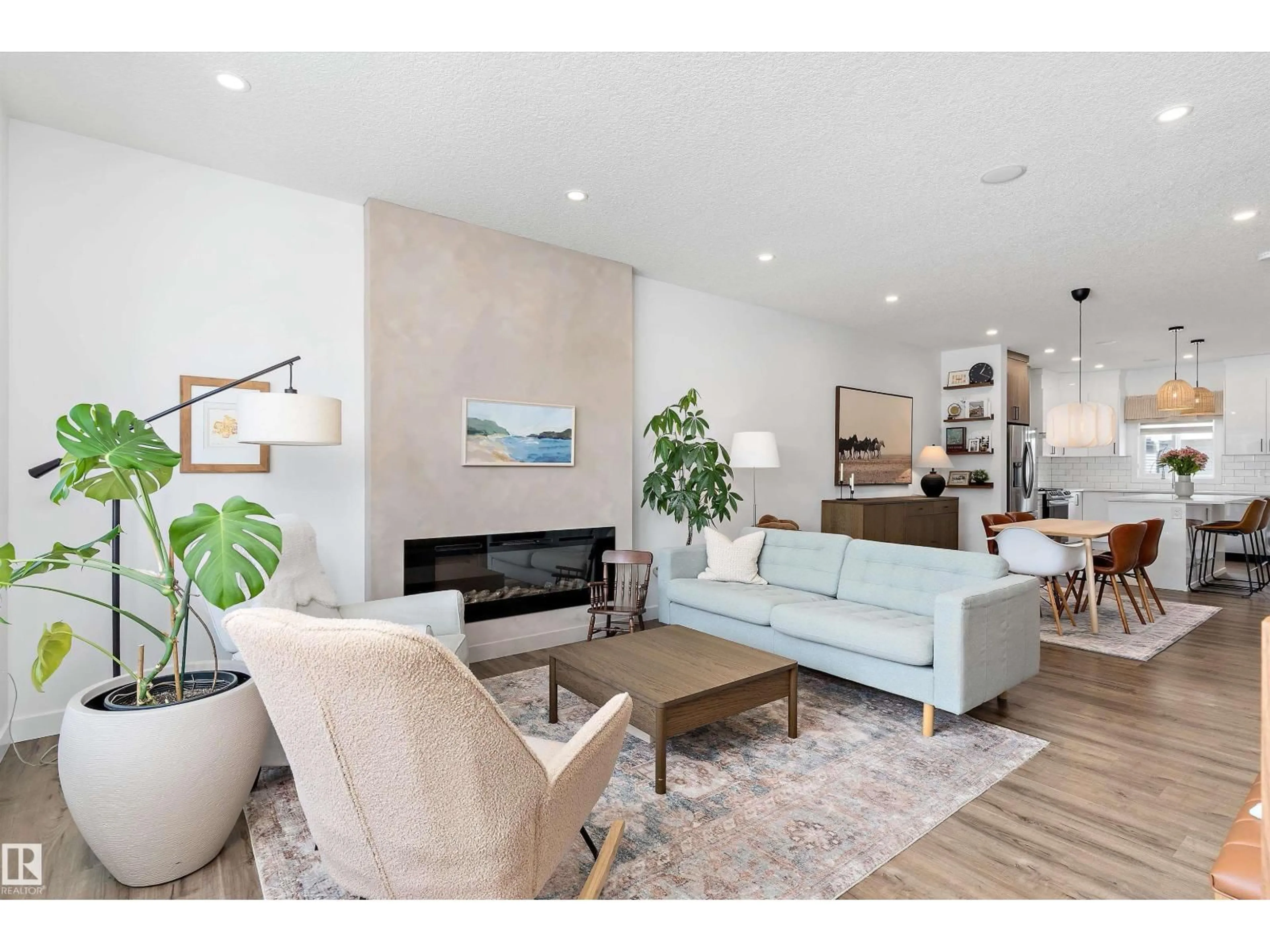 Living room with furniture, wood/laminate floor for 1305 ENRIGHT LD, Edmonton Alberta T6M0Z3