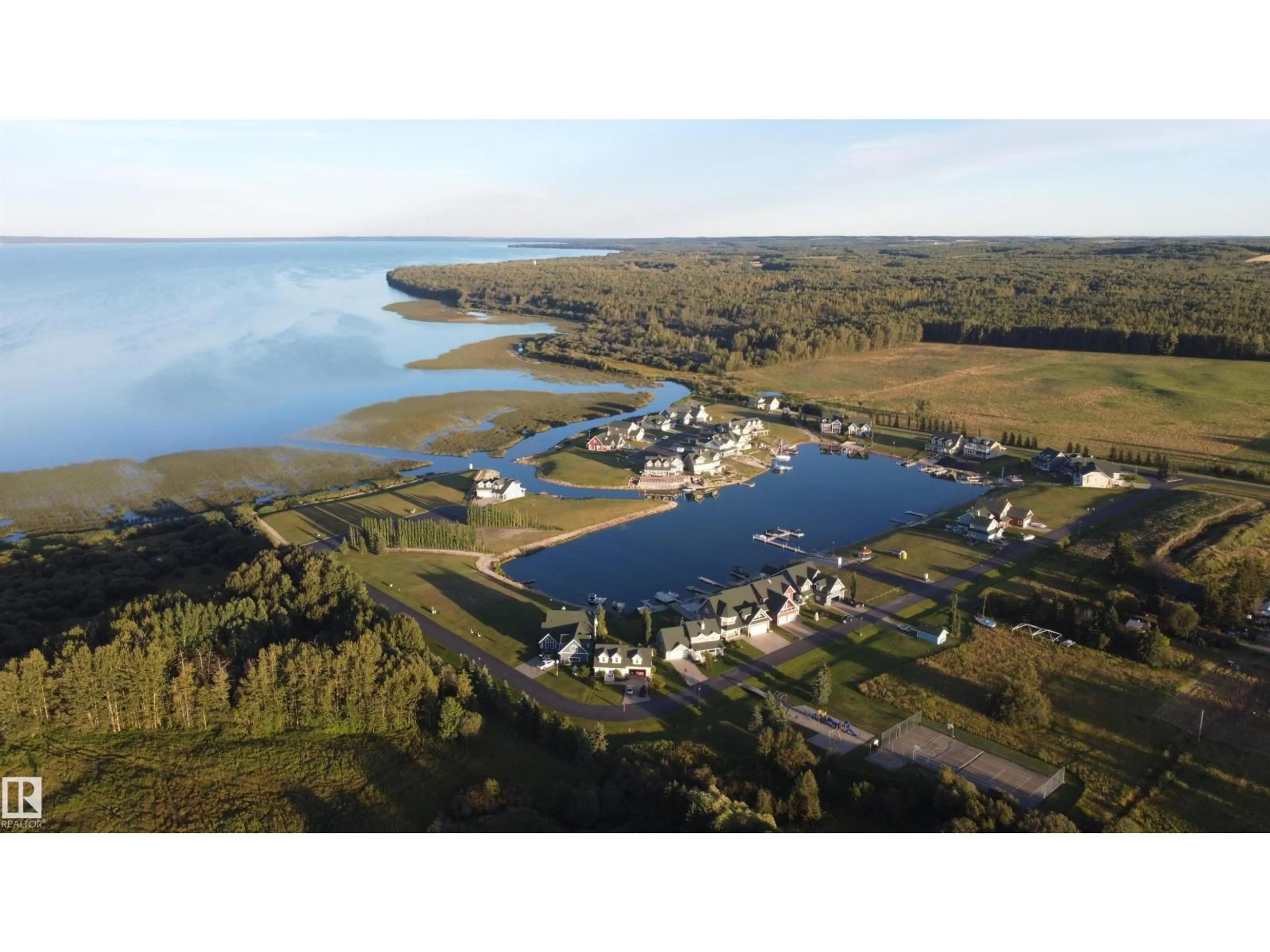 A pic from outside/outdoor area/front of a property/back of a property/a pic from drone, water/lake/river/ocean view for 17 SUNSET HARBOUR, Rural Wetaskiwin County Alberta T0C2V0