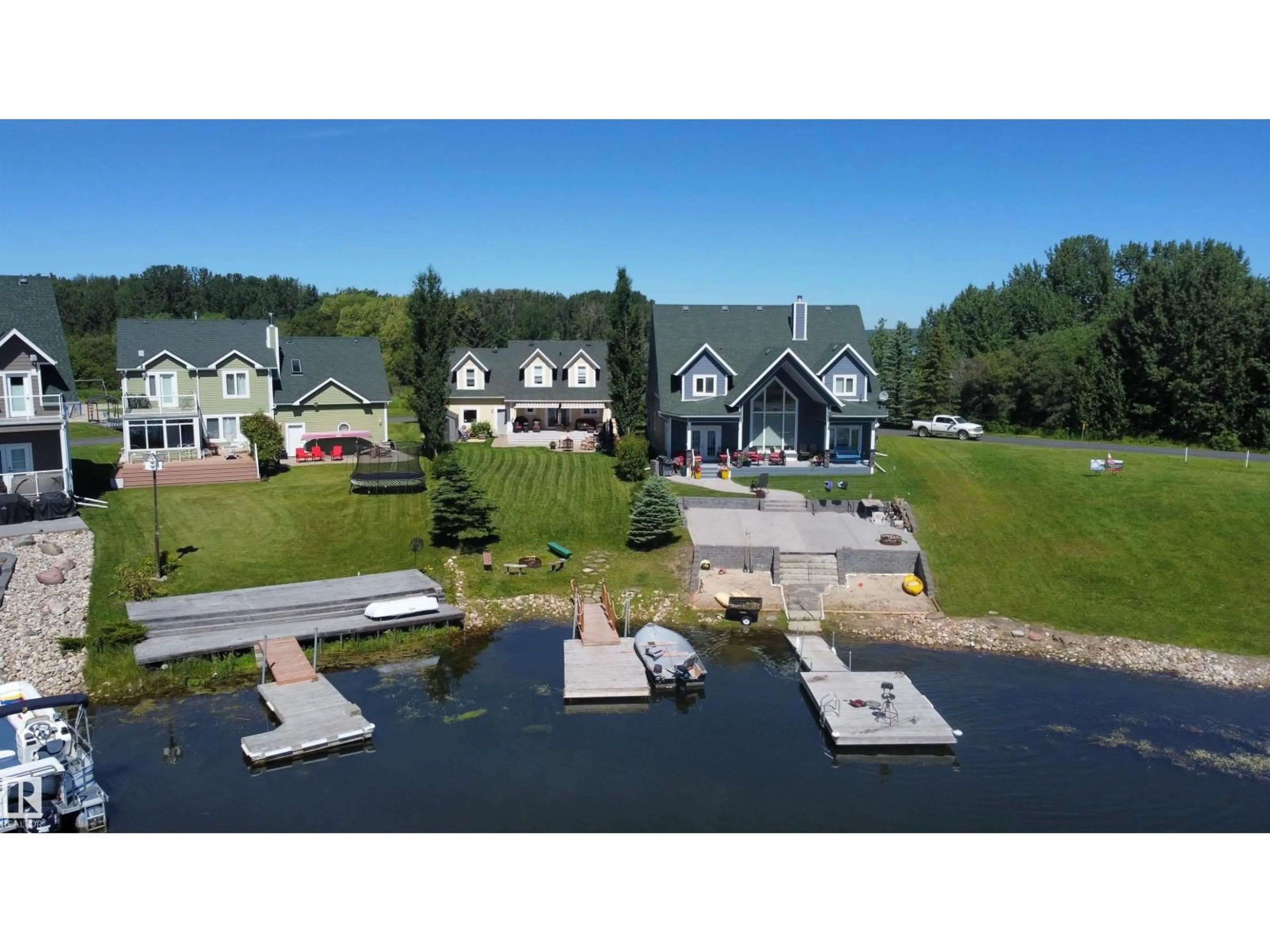 A pic from outside/outdoor area/front of a property/back of a property/a pic from drone, water/lake/river/ocean view for 17 SUNSET HARBOUR, Rural Wetaskiwin County Alberta T0C2V0