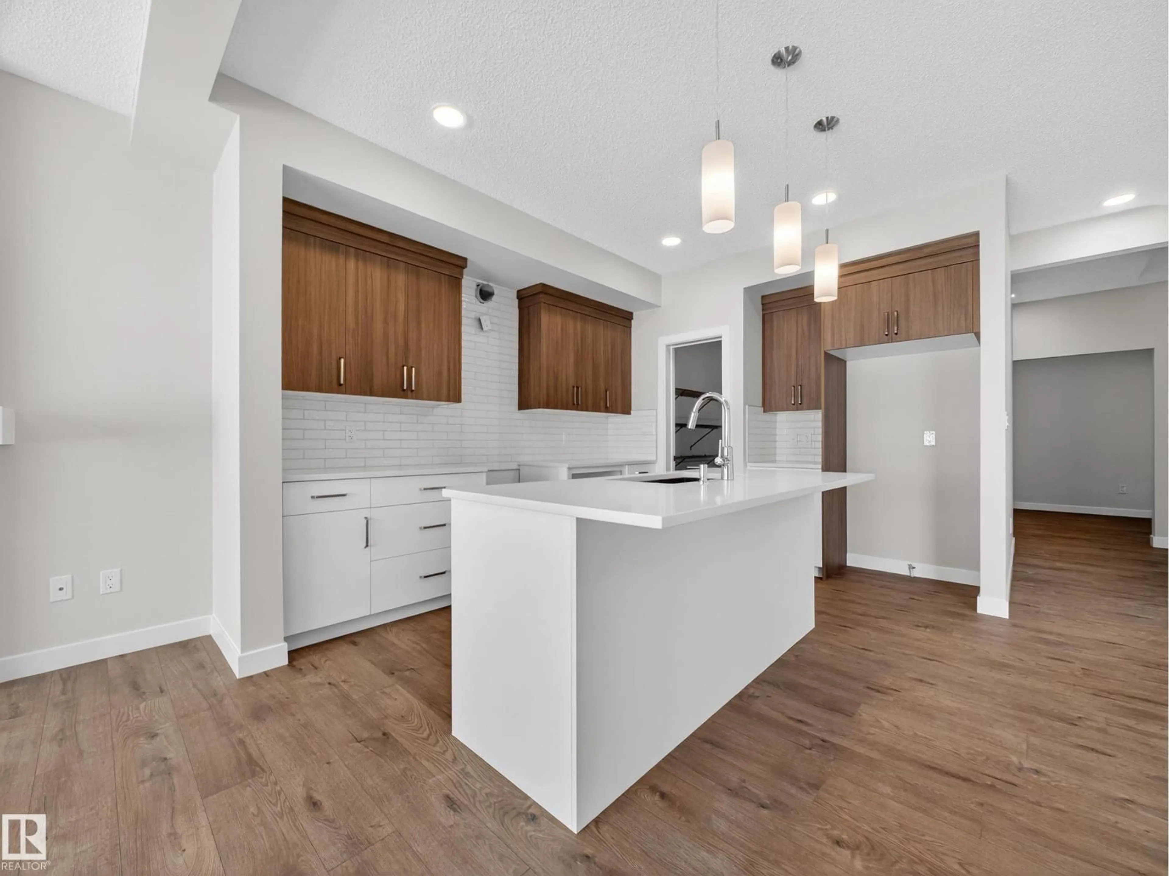 Open concept kitchen, wood/laminate floor for 6308 42 AV, Beaumont Alberta T4X3E8