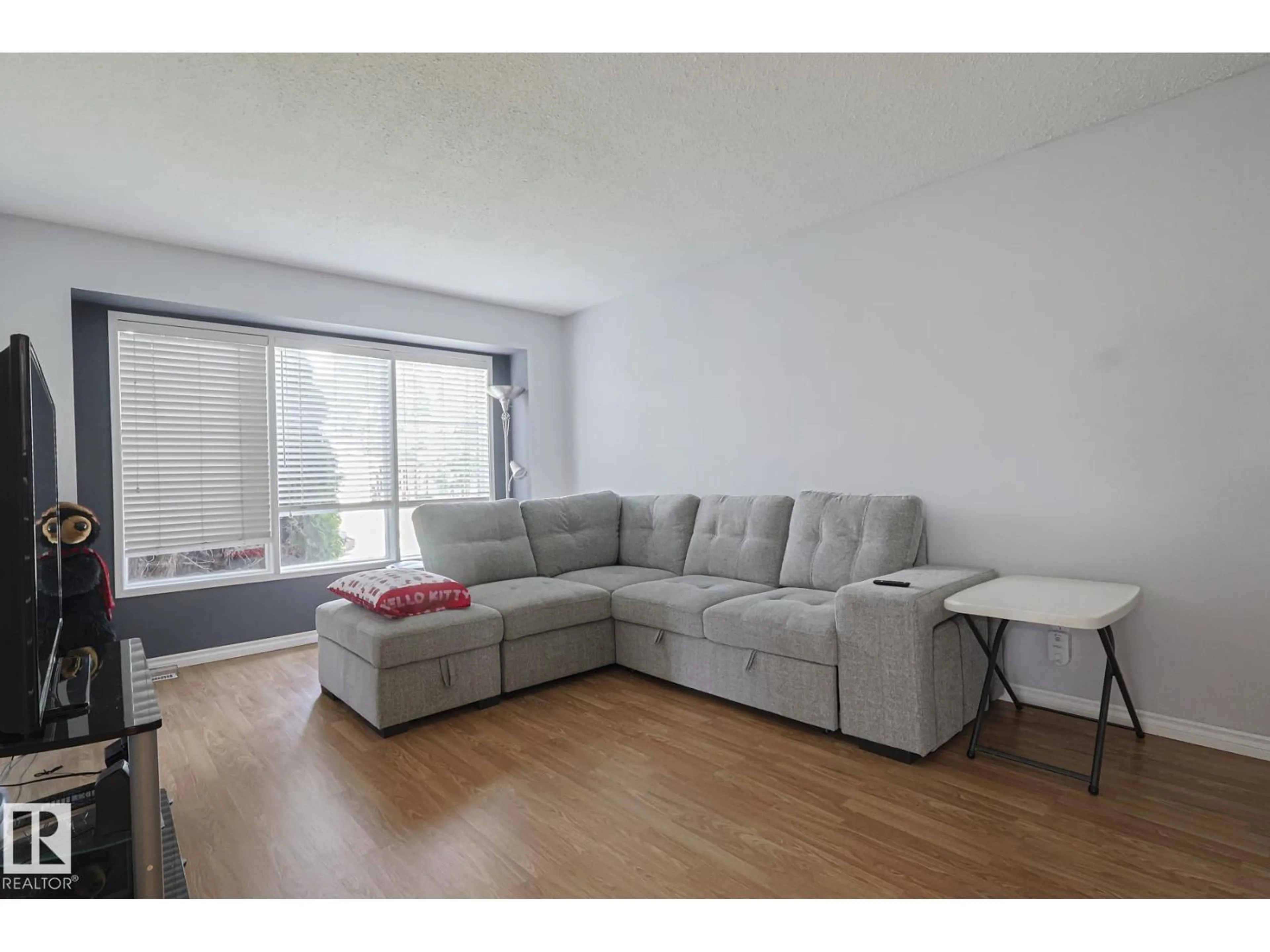 Living room with furniture, unknown for 10439 16 AV, Edmonton Alberta T6J5T1