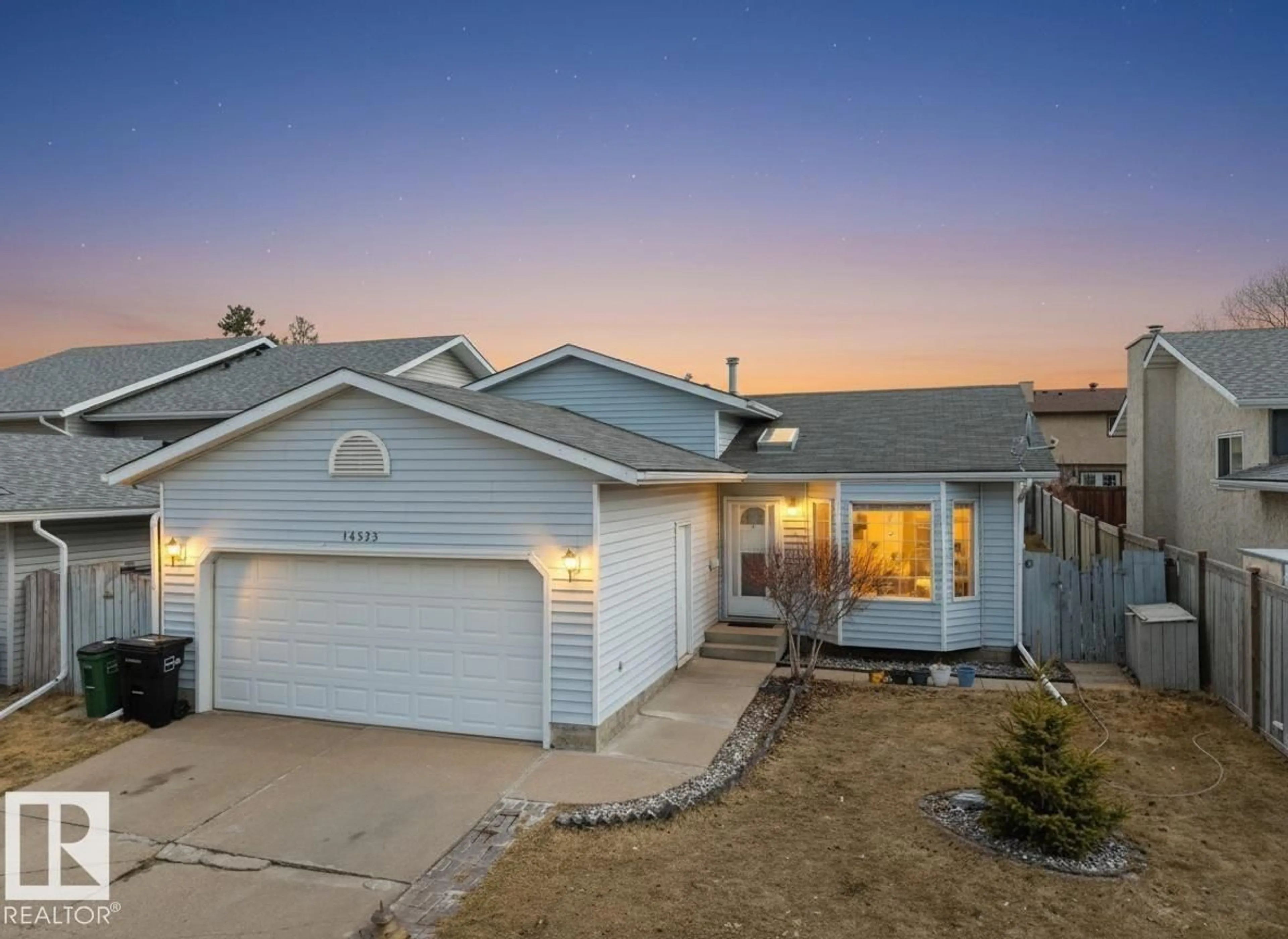 Home with vinyl exterior material, street for NW - 14523 32 ST, Edmonton Alberta T5Y2L2