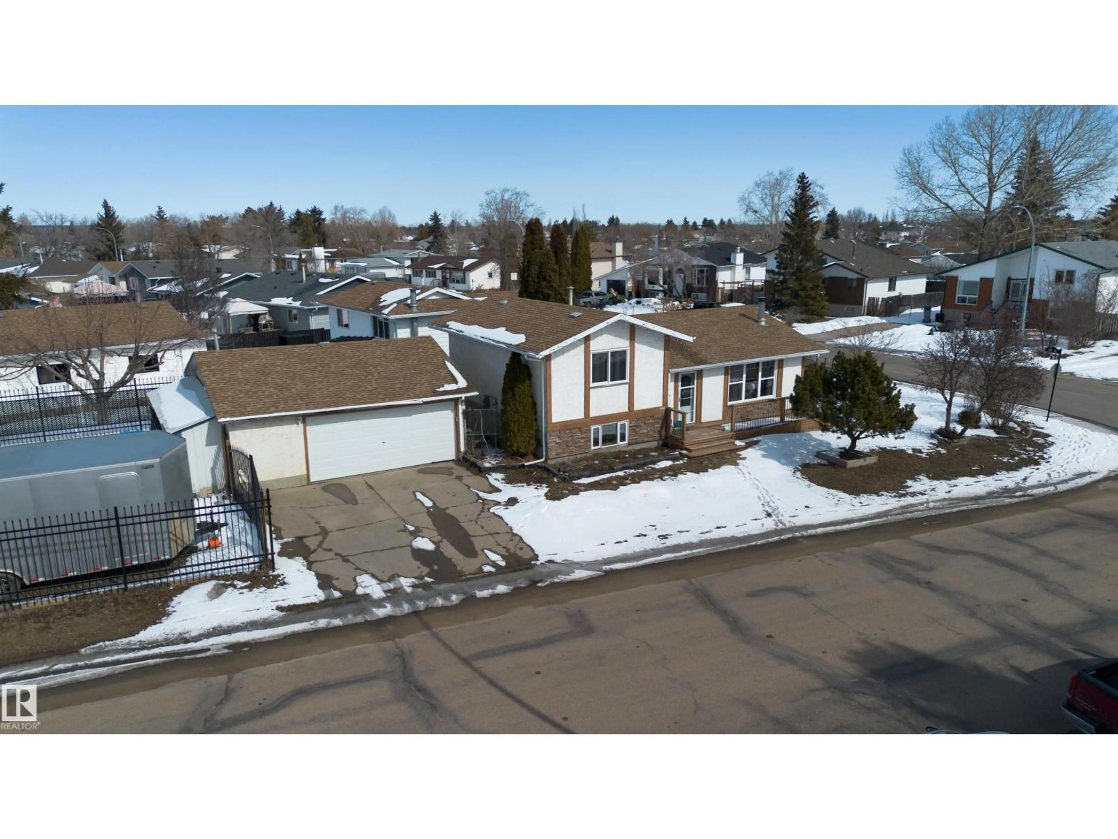 A pic from outside/outdoor area/front of a property/back of a property/a pic from drone, street for 9702 95 AV, Morinville Alberta T8R1H4