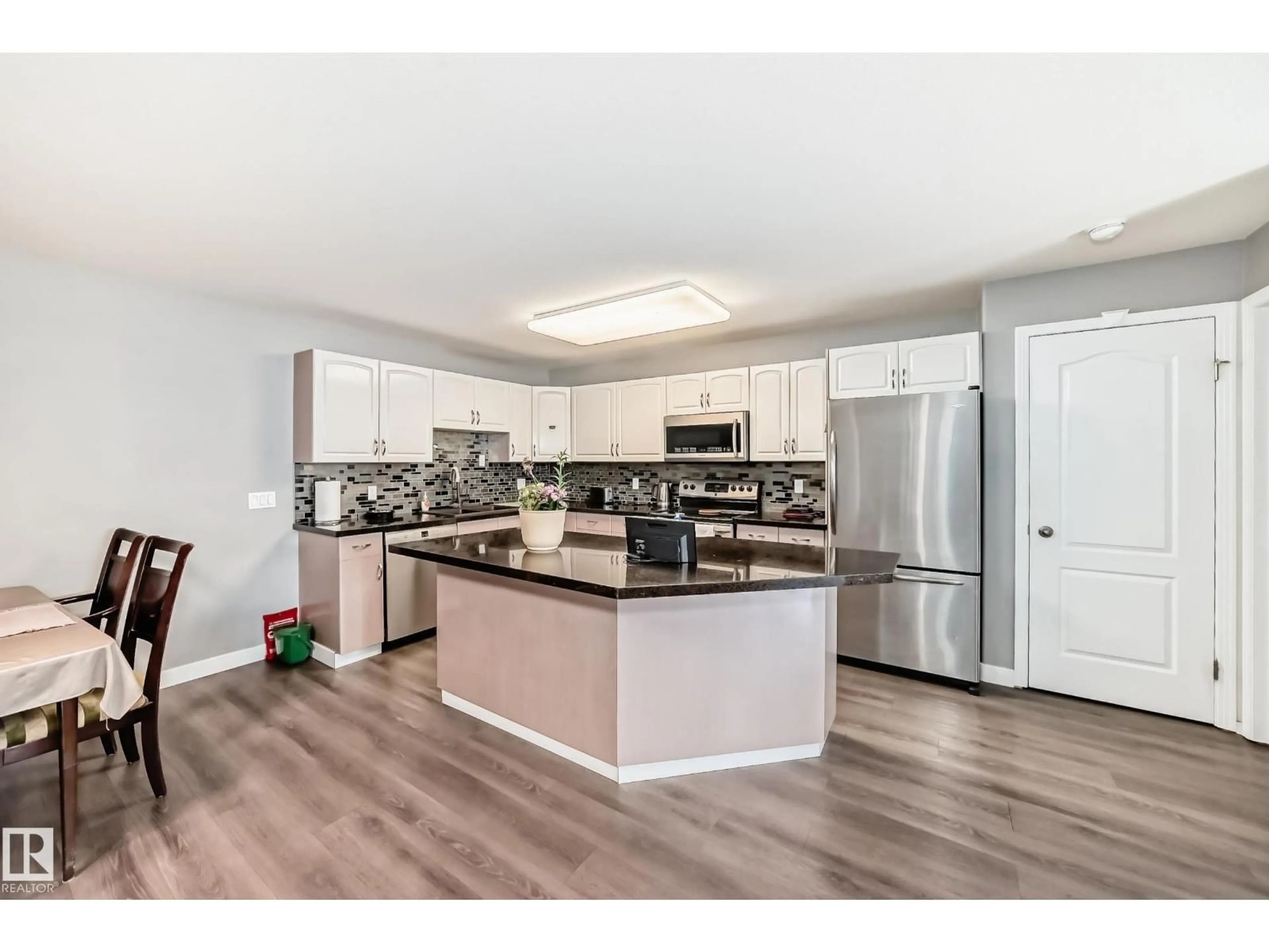 Open concept kitchen, unknown for #119 - 10421 42 AV, Edmonton Alberta T8J7C8