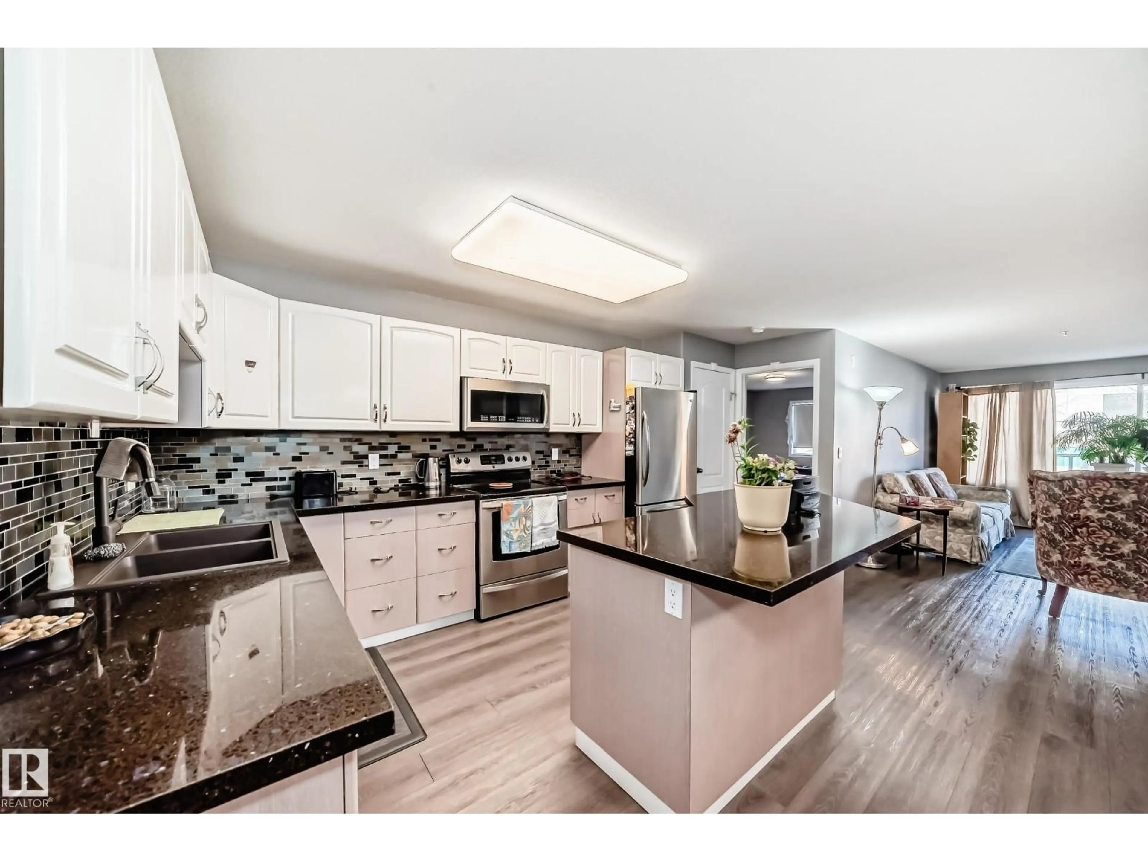 Open concept kitchen, ceramic/tile floor for #119 - 10421 42 AV, Edmonton Alberta T8J7C8