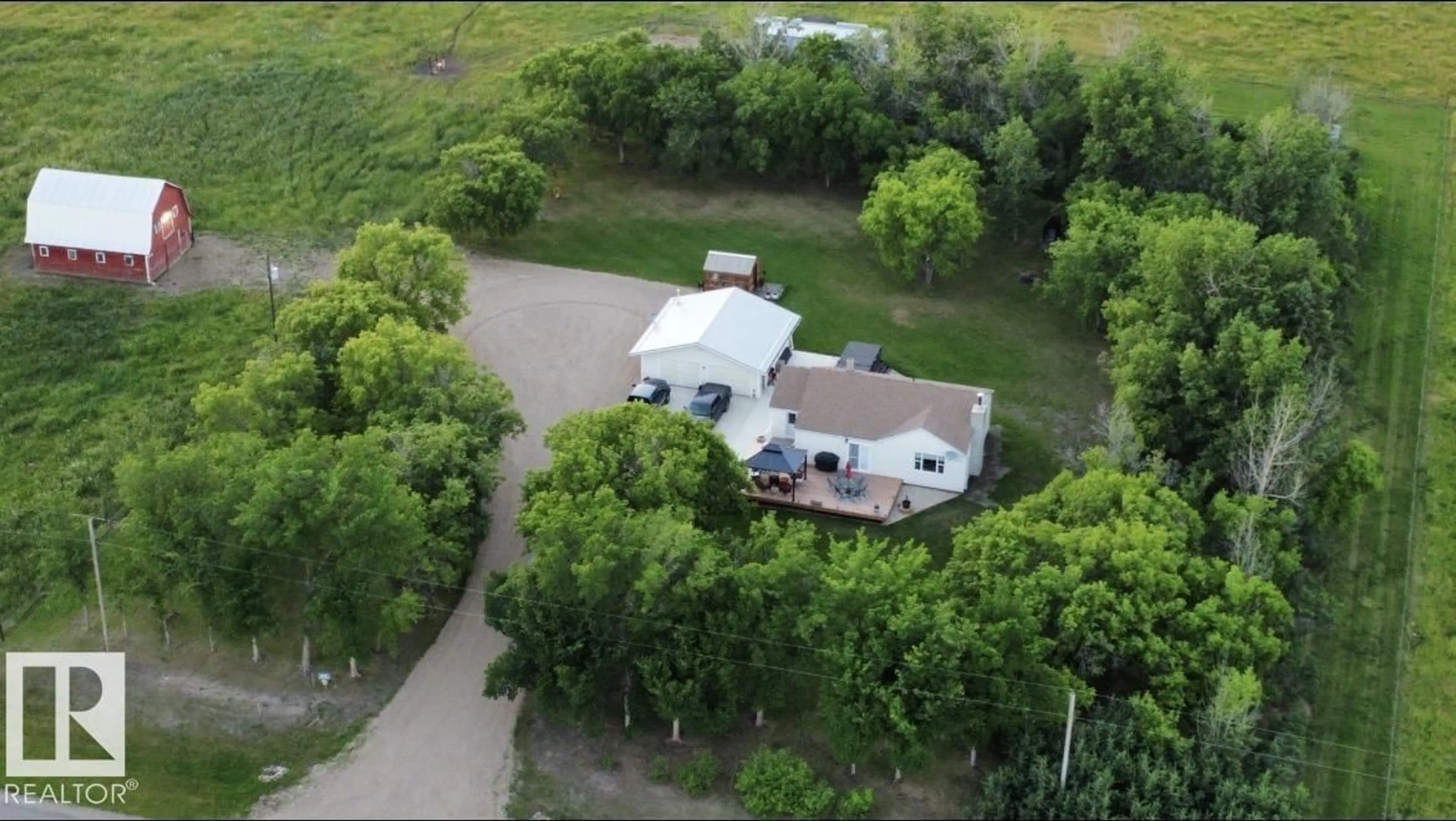 A pic from outside/outdoor area/front of a property/back of a property/a pic from drone, street for 610 - 45416 TWN RD, Rural Bonnyville M.D. Alberta T9N2G9
