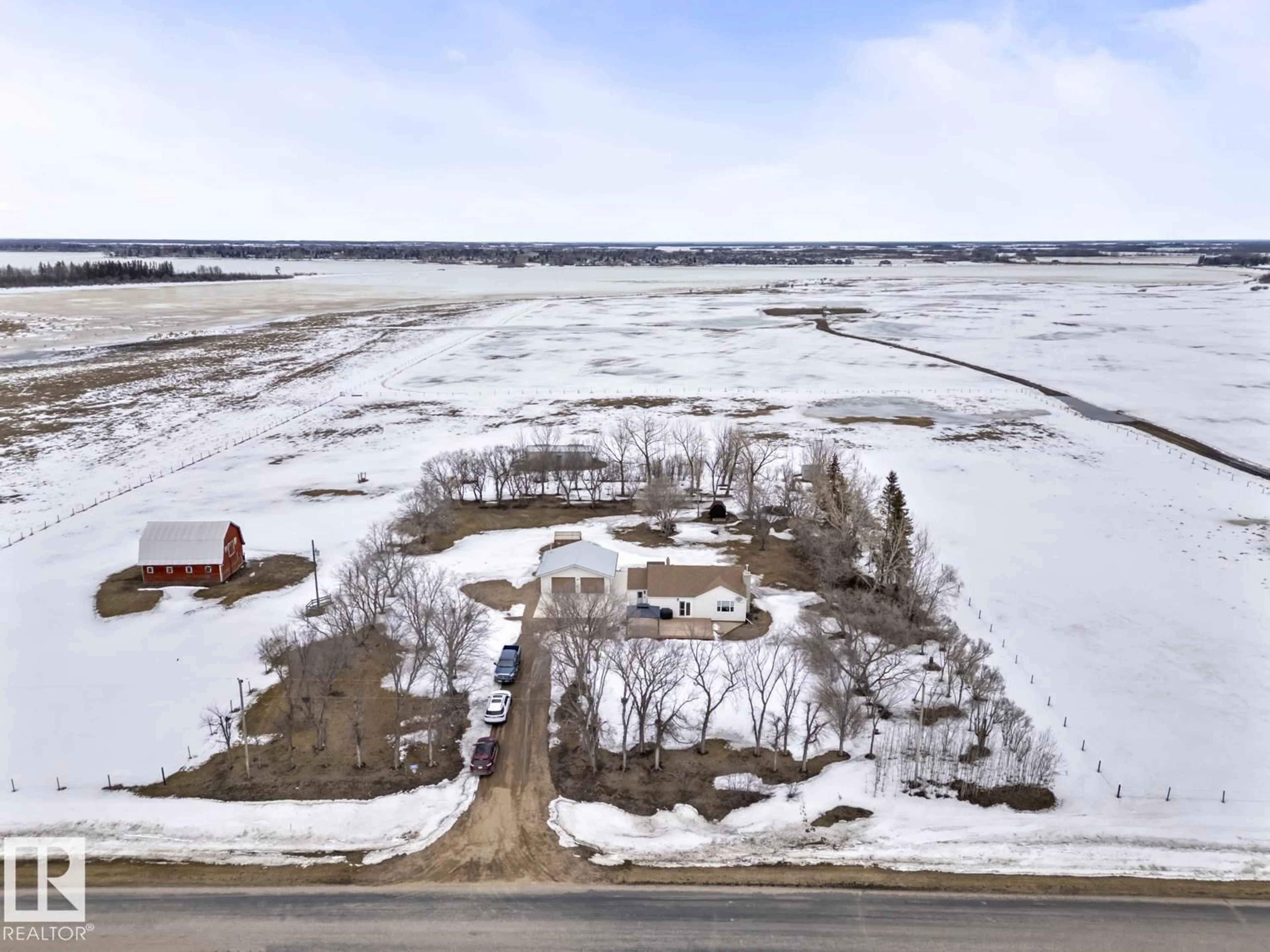 A pic from outside/outdoor area/front of a property/back of a property/a pic from drone, water/lake/river/ocean view for 610 - 45416 TWN RD, Rural Bonnyville M.D. Alberta T9N2G9