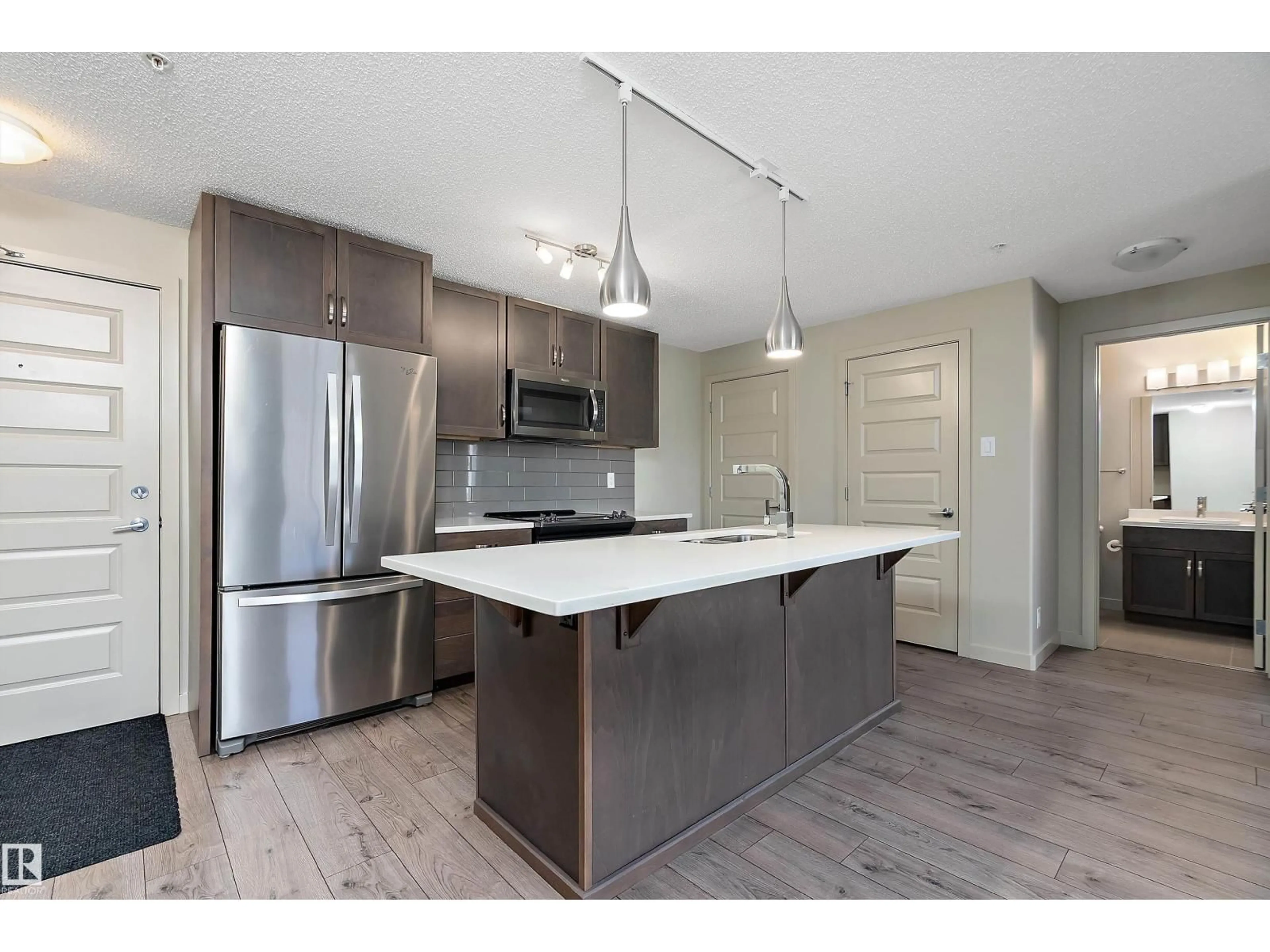 Open concept kitchen, unknown for #309 - 4008 SAVARYN DR, Edmonton Alberta T6X2E5