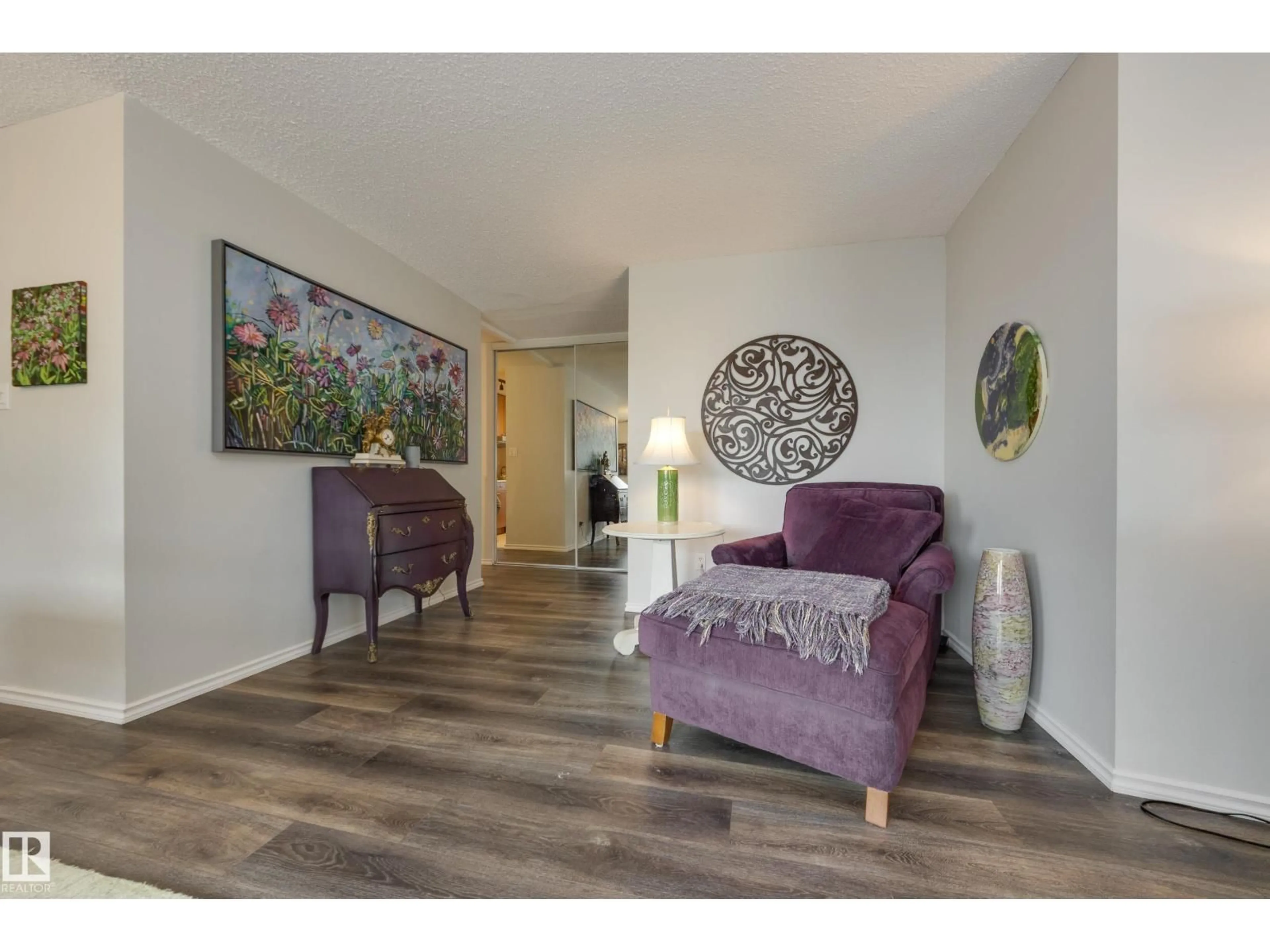 Living room with furniture, wood/laminate floor for 9909 - 1001 110 ST NW, Edmonton Alberta T5K2E5