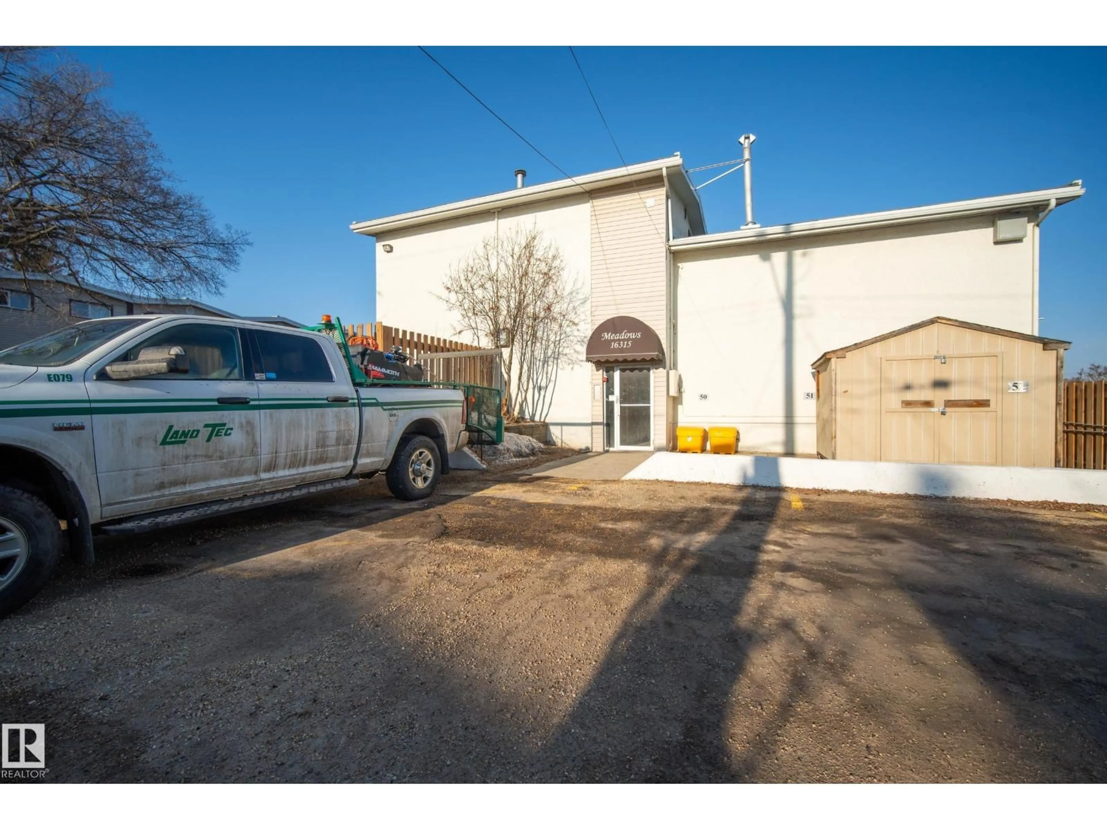 A pic from outside/outdoor area/front of a property/back of a property/a pic from drone, street for E - 16315 89 AV, Edmonton Alberta T5R4S1