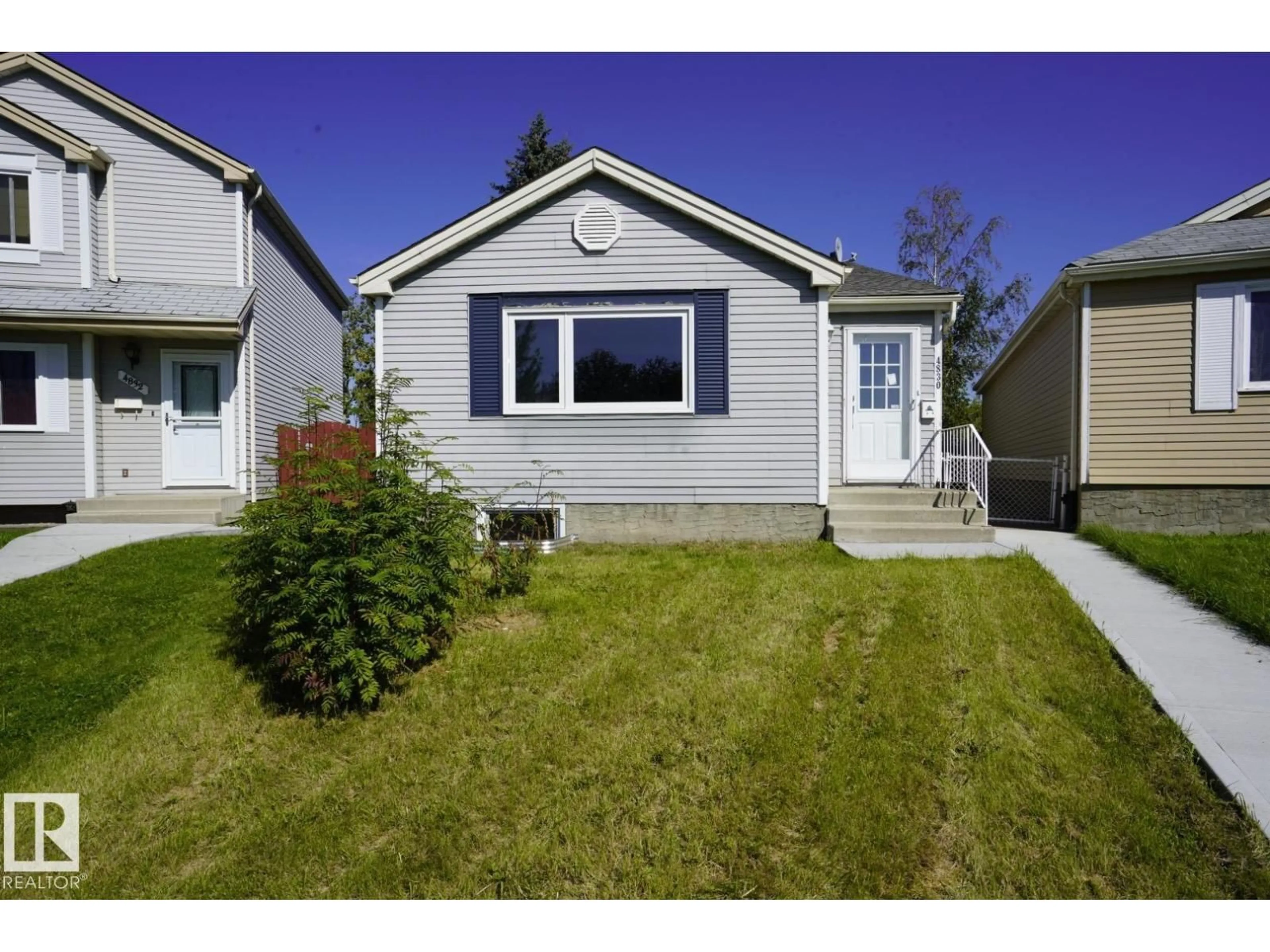 Home with vinyl exterior material, street for 4830 32 AV, Edmonton Alberta T6L4H9