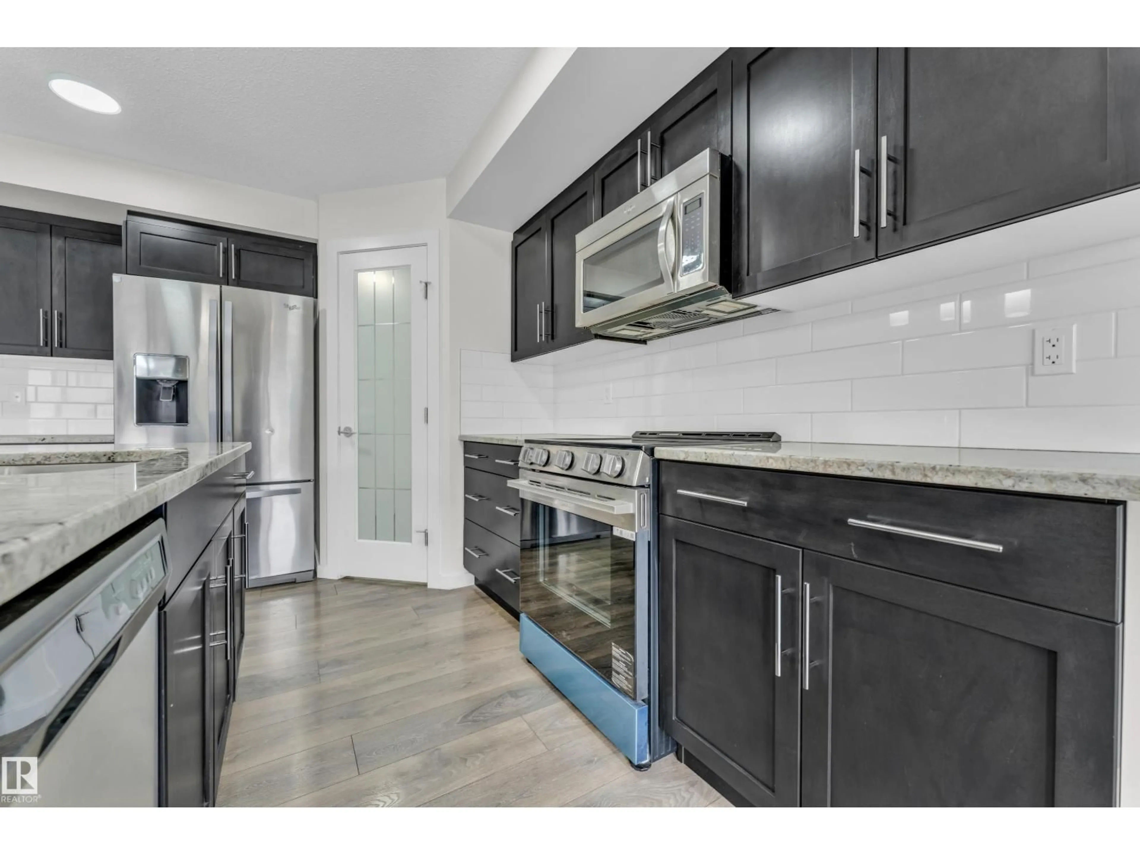 Open concept kitchen, ceramic/tile floor for 4416 6 ST, Edmonton Alberta T6T0Z8