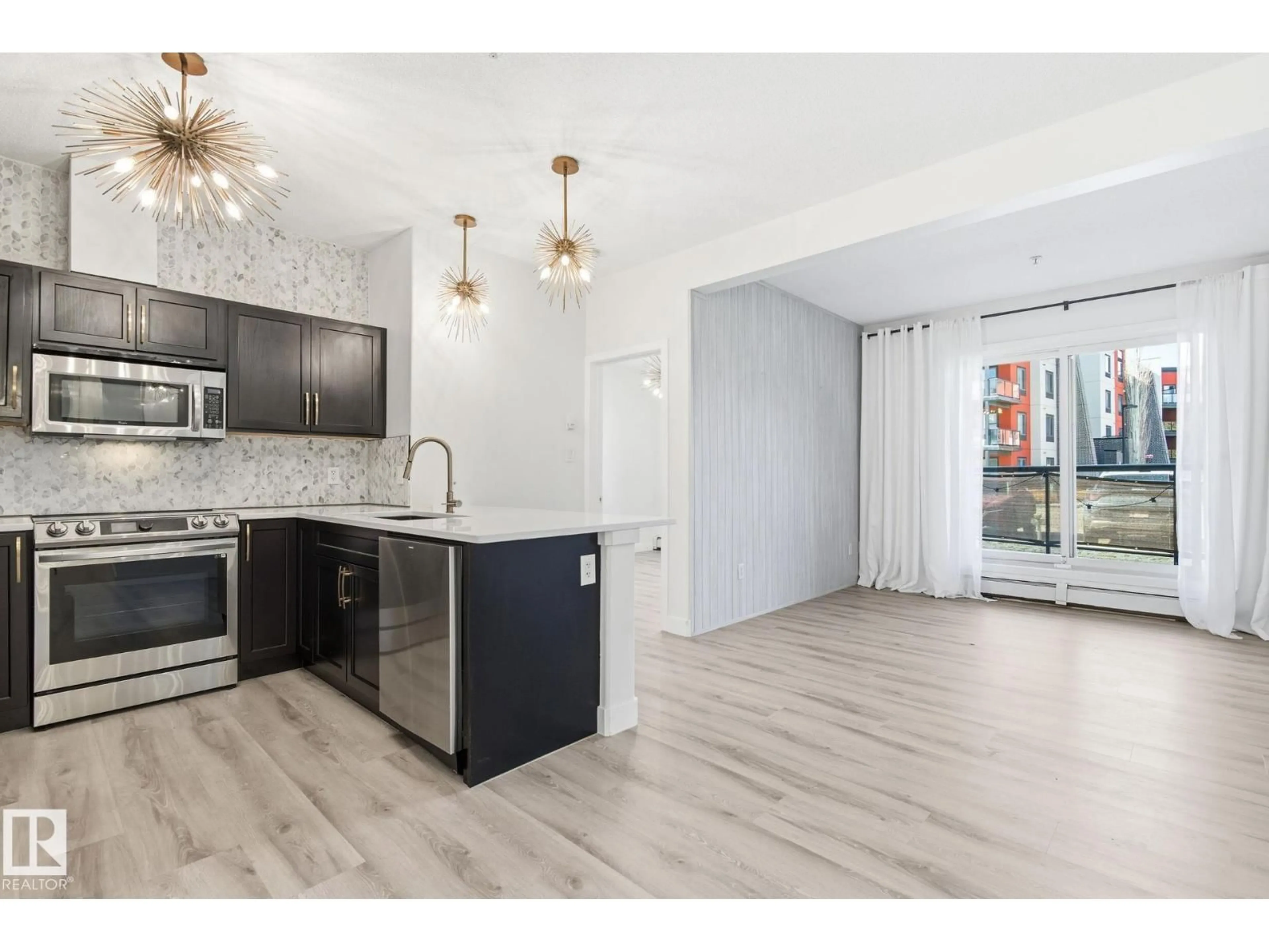 Open concept kitchen, unknown for #105 - 304 AMBLESIDE LINK LI, Edmonton Alberta T6W0V2