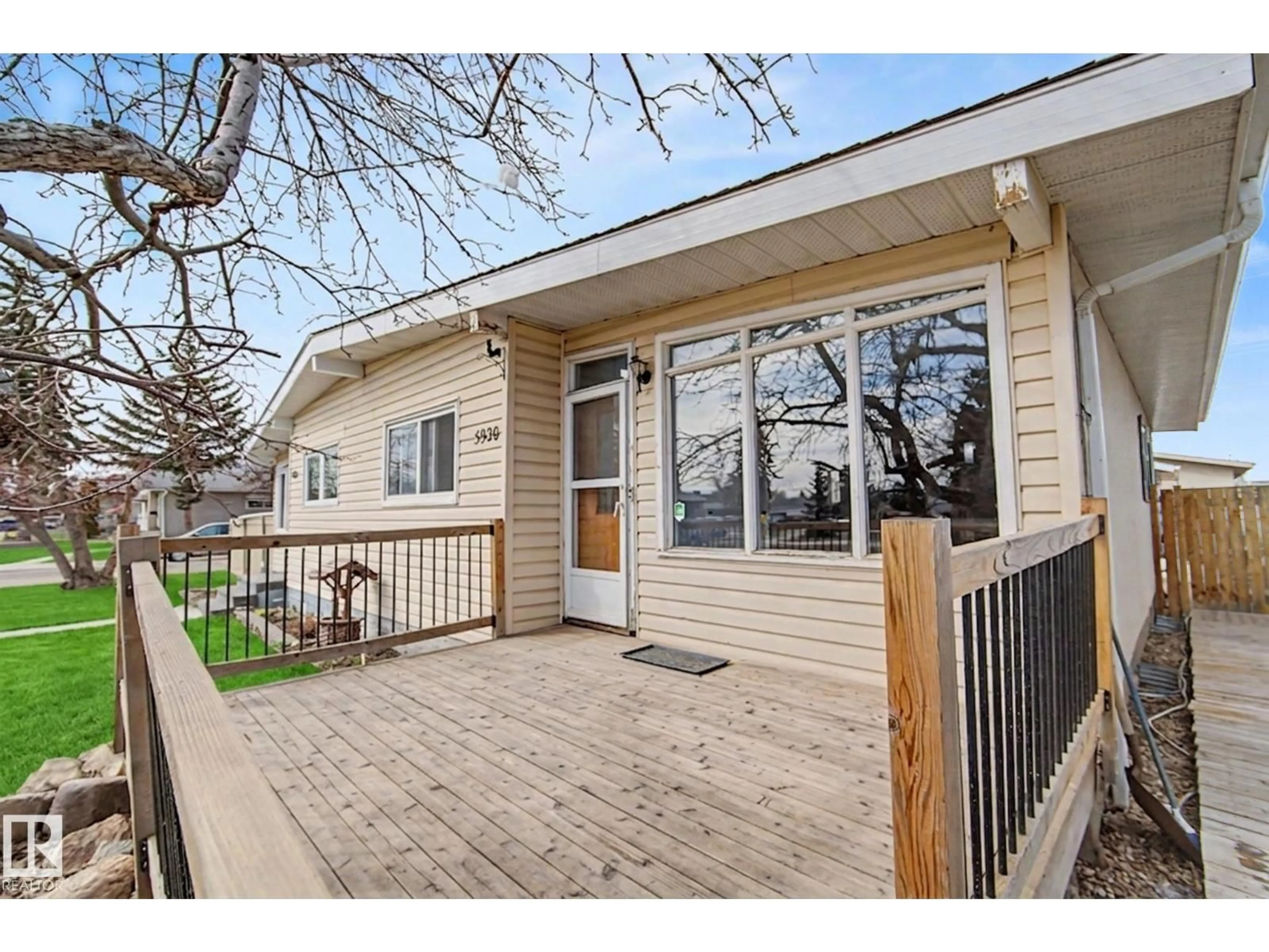 Home with vinyl exterior material, street for 5920 132 AV, Edmonton Alberta T5A0J1