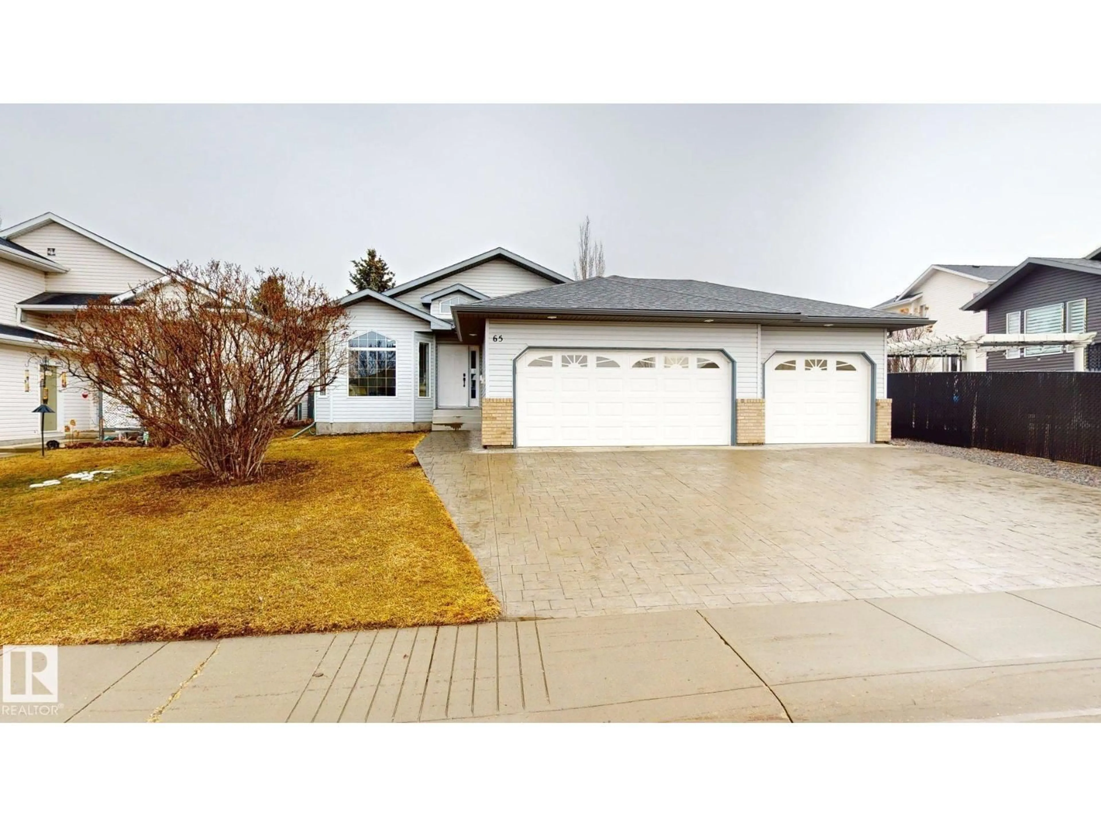 Home with vinyl exterior material, street for 65 RIVERPARK RD, Fort Saskatchewan Alberta T8L4K5