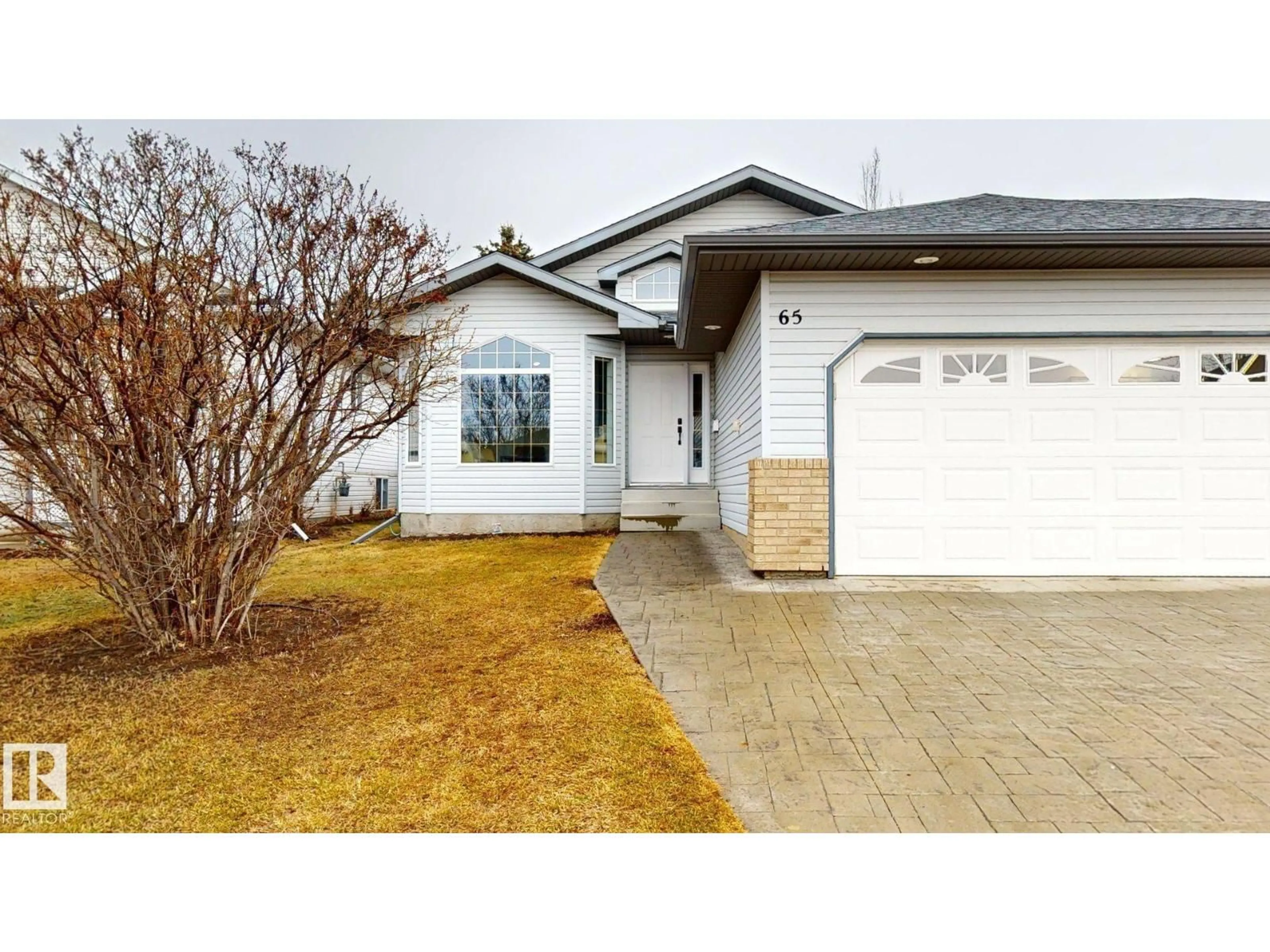 Home with vinyl exterior material, street for 65 RIVERPARK RD, Fort Saskatchewan Alberta T8L4K5
