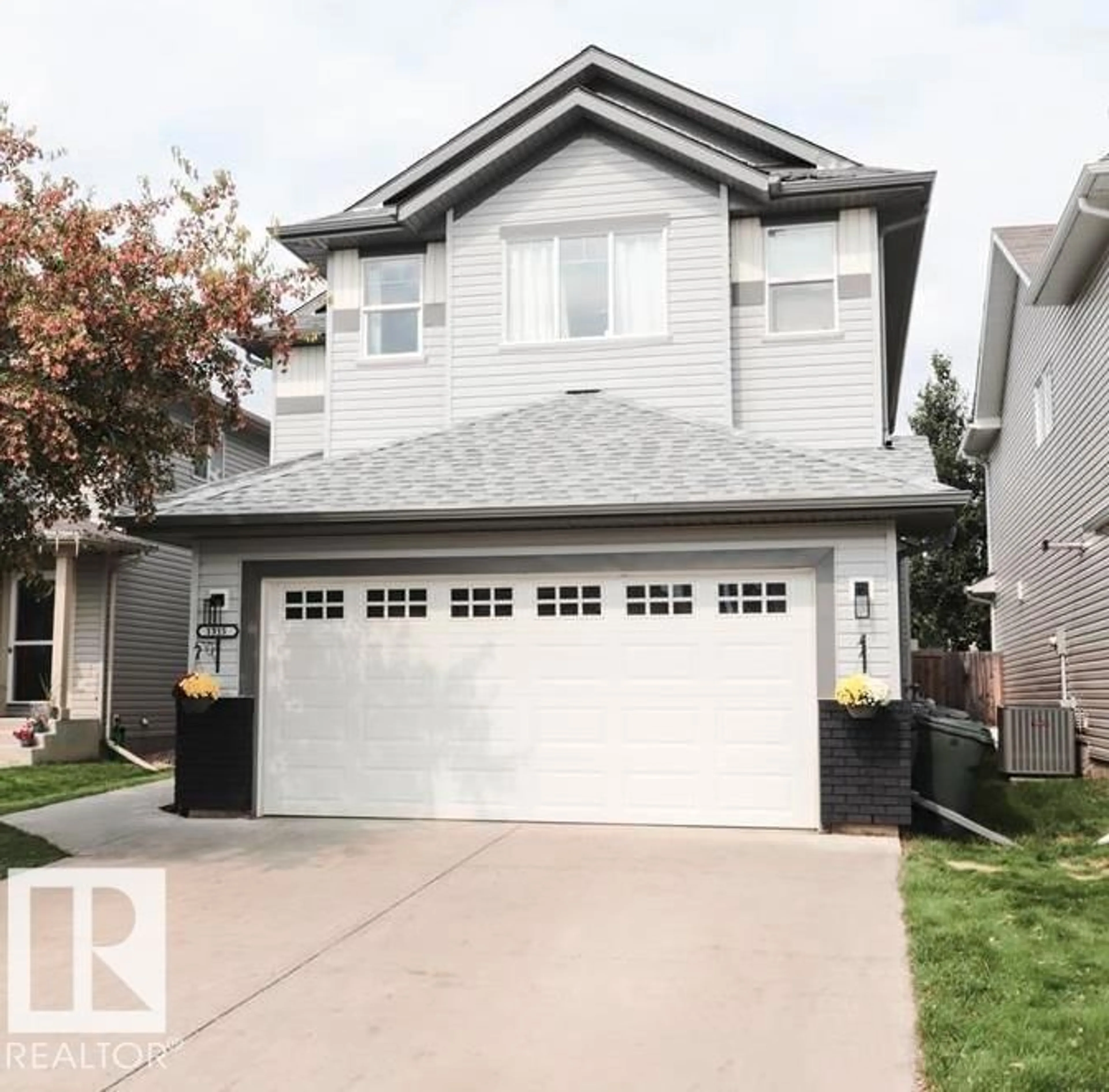 Home with vinyl exterior material, street for 1315 WESTERRA DR, Stony Plain Alberta T7Z0B2